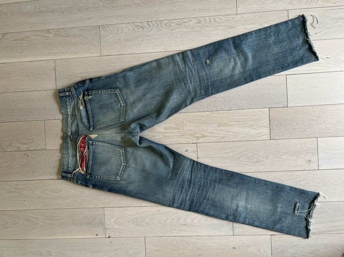 Saint Laurent Paris Yves Saint Laurent Saint Laurent washed blue jeans with bandana on back pocket Grailed