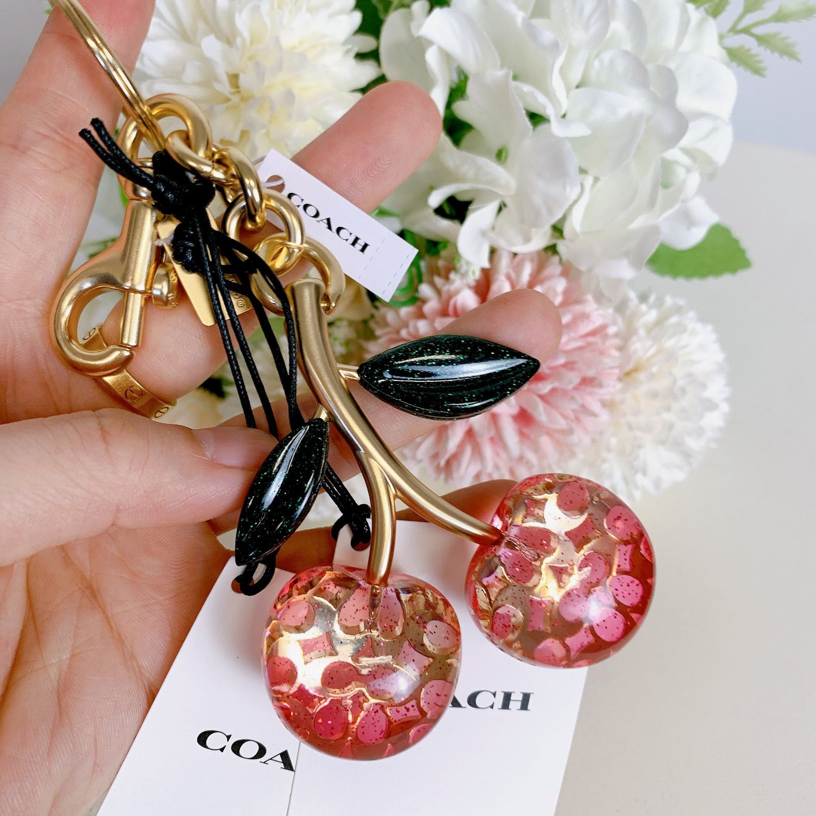 NWT top Coach Signature Bag Charm Keyring pink & gold