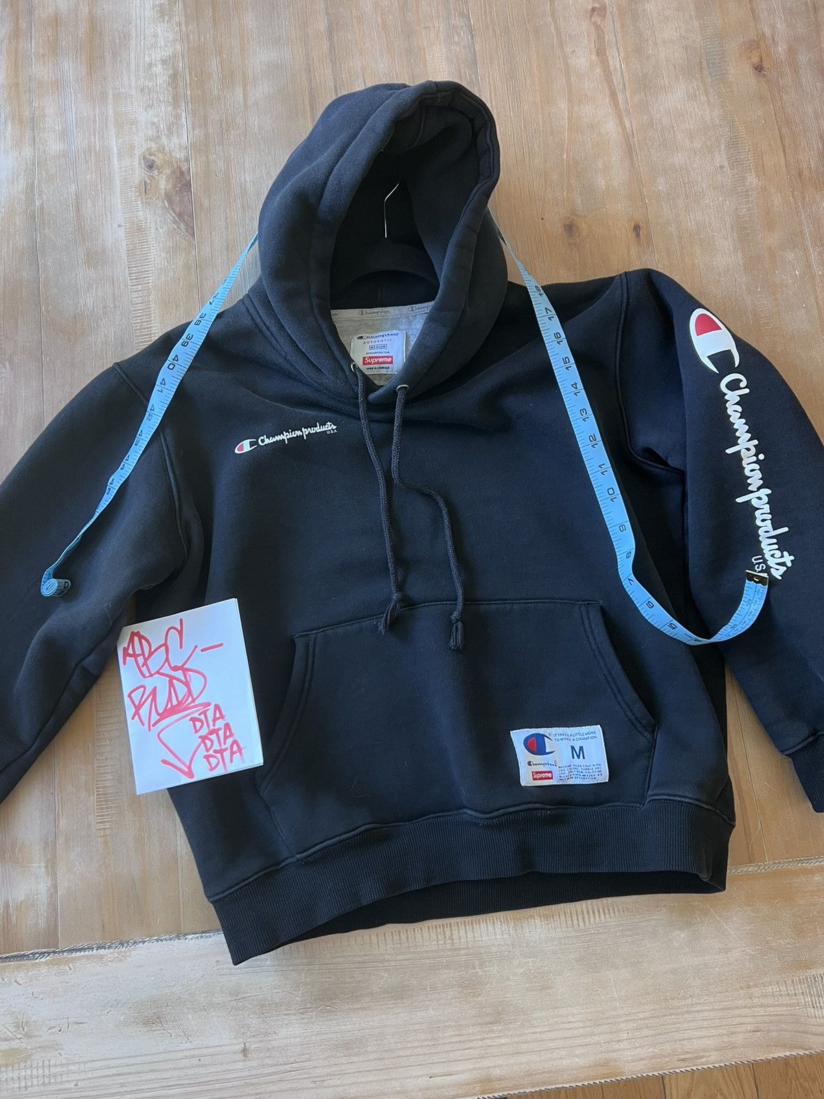Champion supreme hoodie black sale