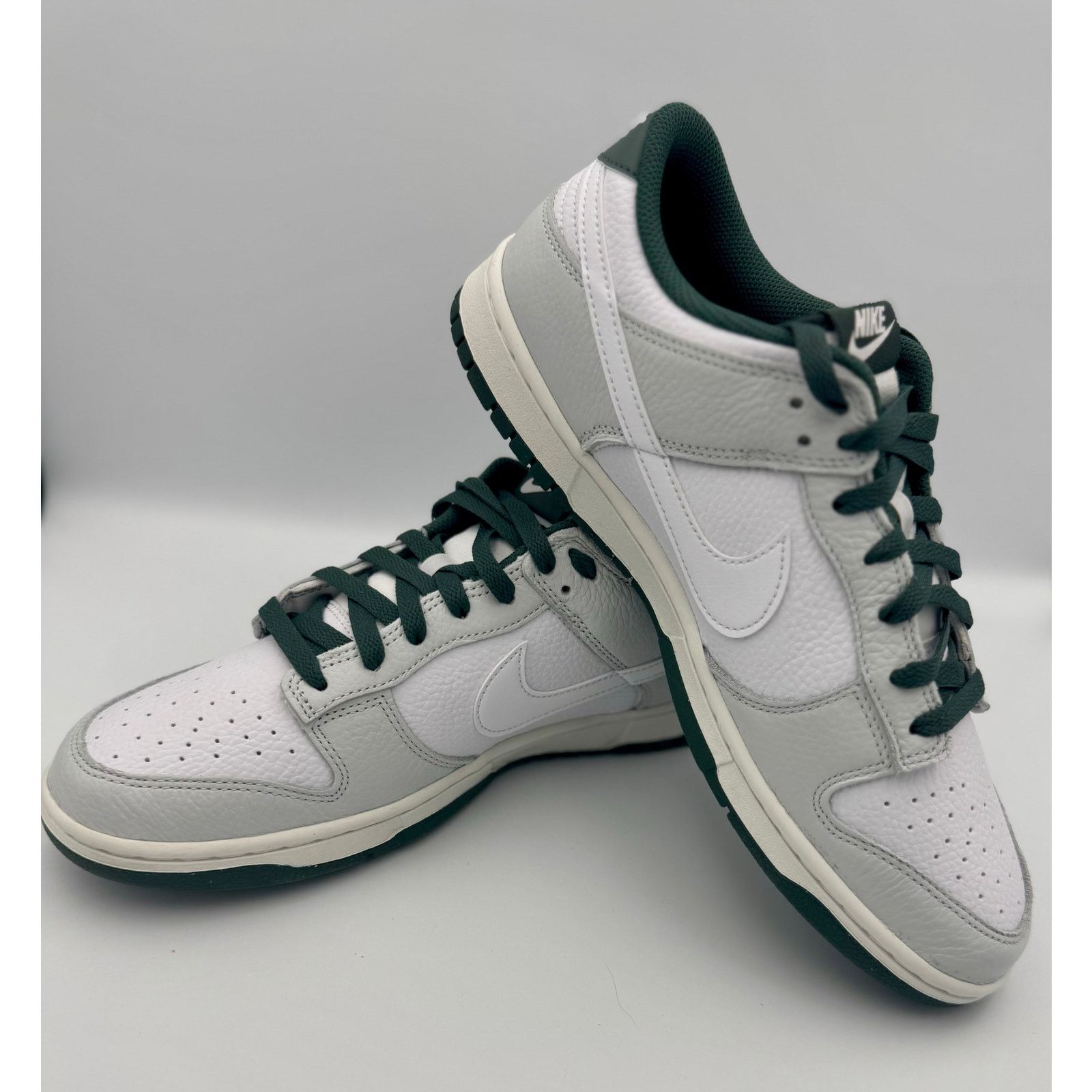 The Nike Dunk Low Retro SE Photon Dust Vintage Green