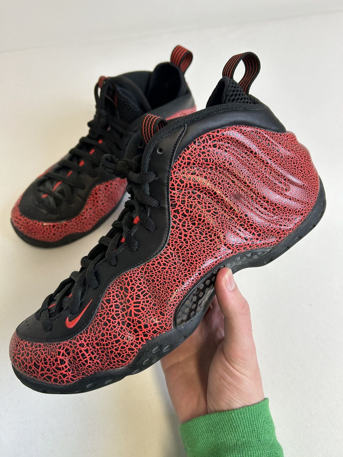 image of Nike Air Foamposite Cracked Lava Shoes in Red, Men's (Size 9.5)
