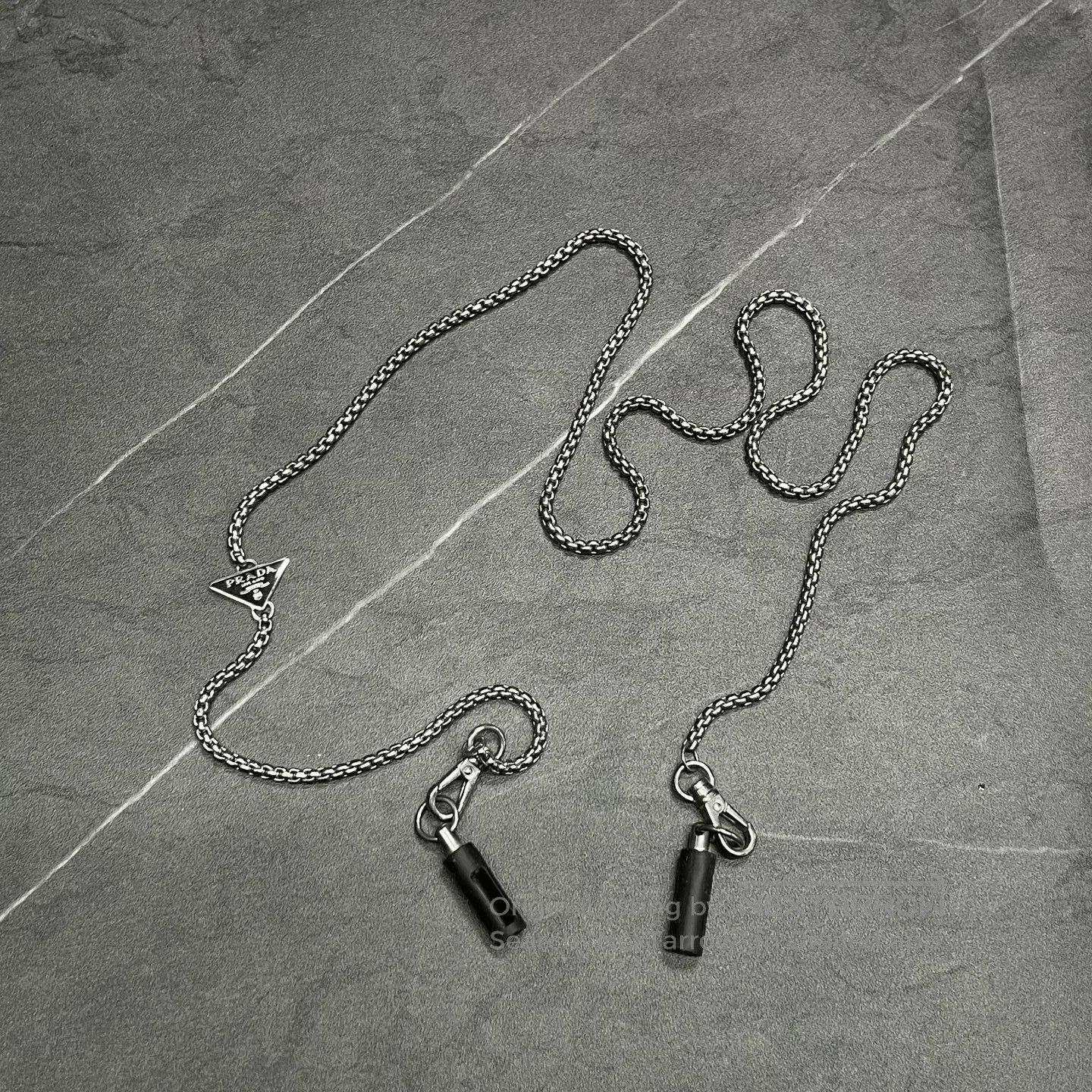 Prada Prada Metal Triangle Logo Headphone Chain. Size ONE SIZE - 1 Thumbnail