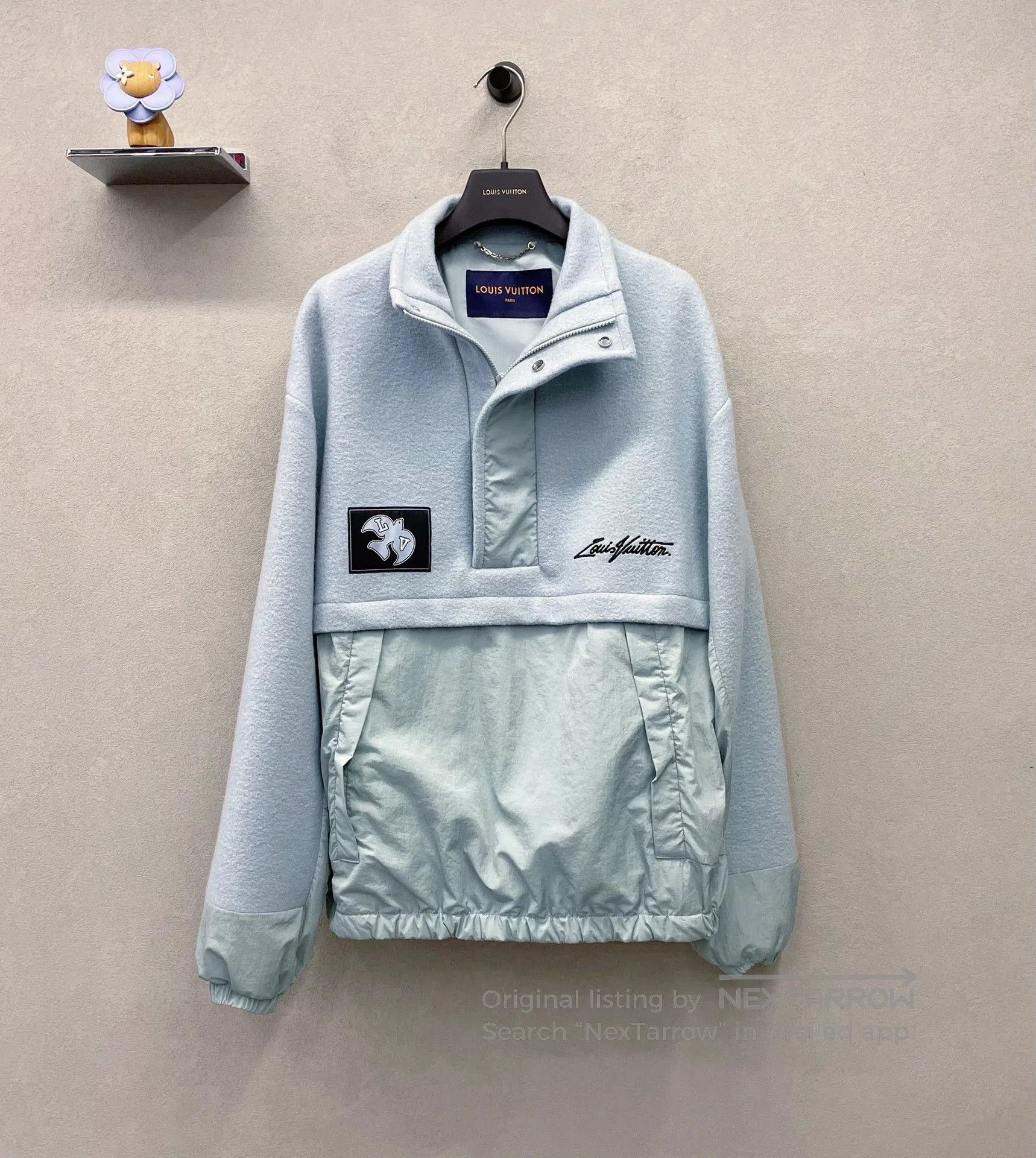 blue oversized sweatshirt with logo design.