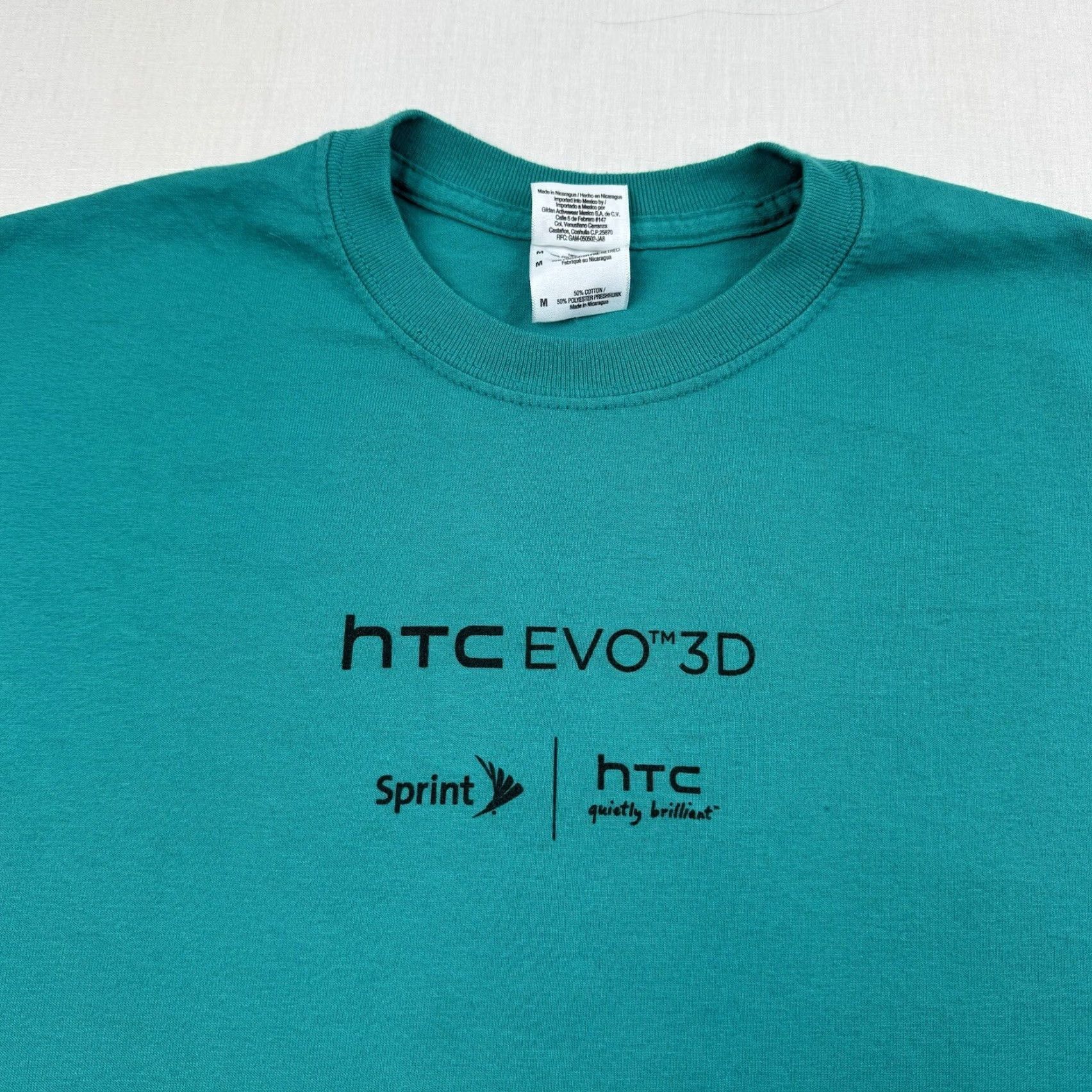 Gildan HTC Evo 3D Cell Phone Promotional Shirt Adult Medium Teal Green Hornet 2011 Model Size US M / EU 48-50 / 2 - 3 Thumbnail
