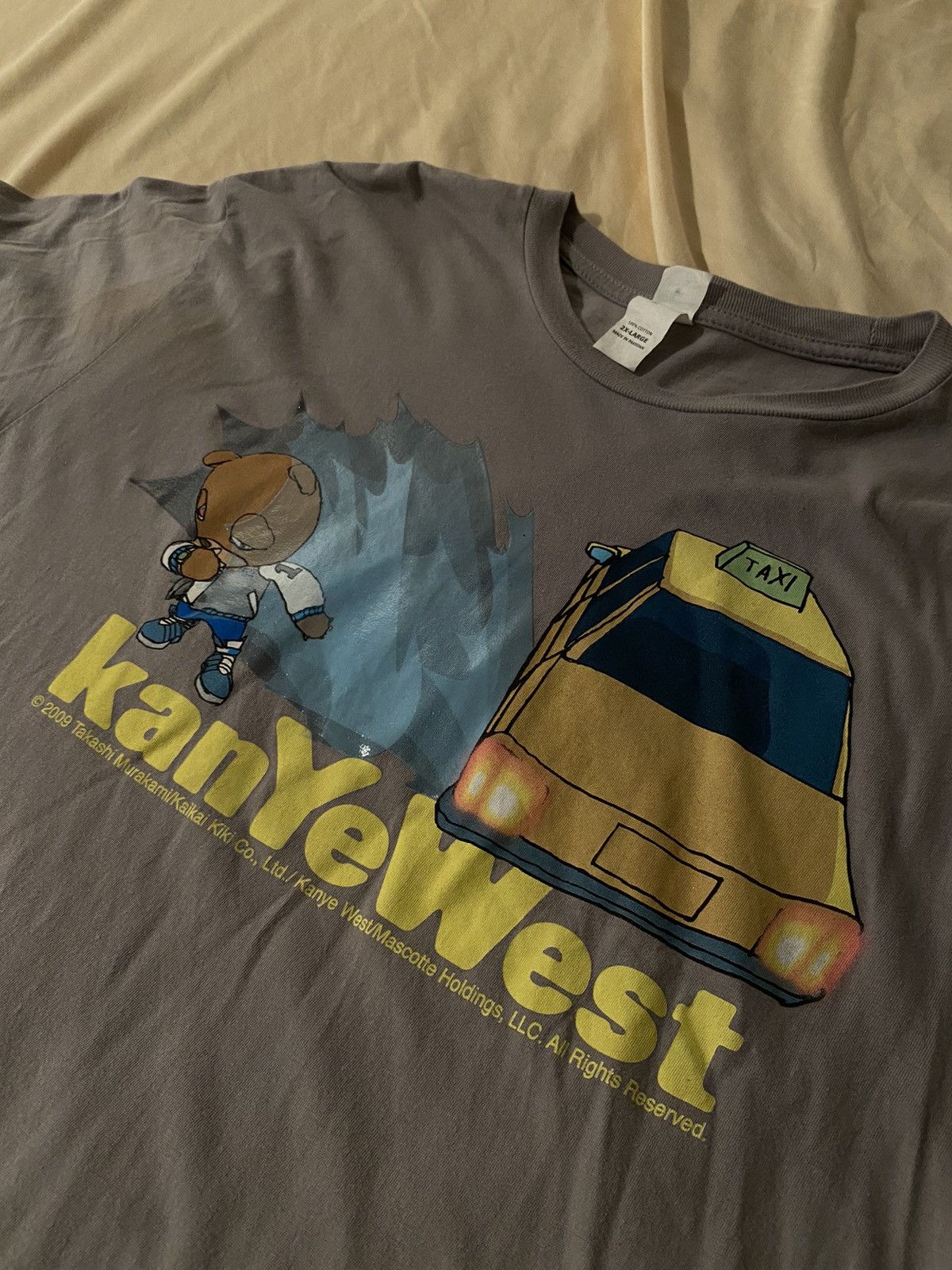 image of 2004 Kanye West Vintage Graduation Taxi Splash Tee Shirt in Grey, Men's (Size 2XL)