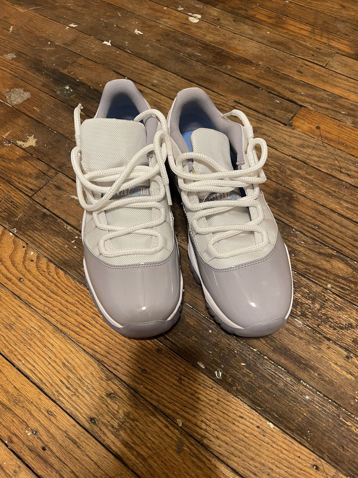 image of Jordan Brand 11 Cement Shoes in White, Men's (Size 9)