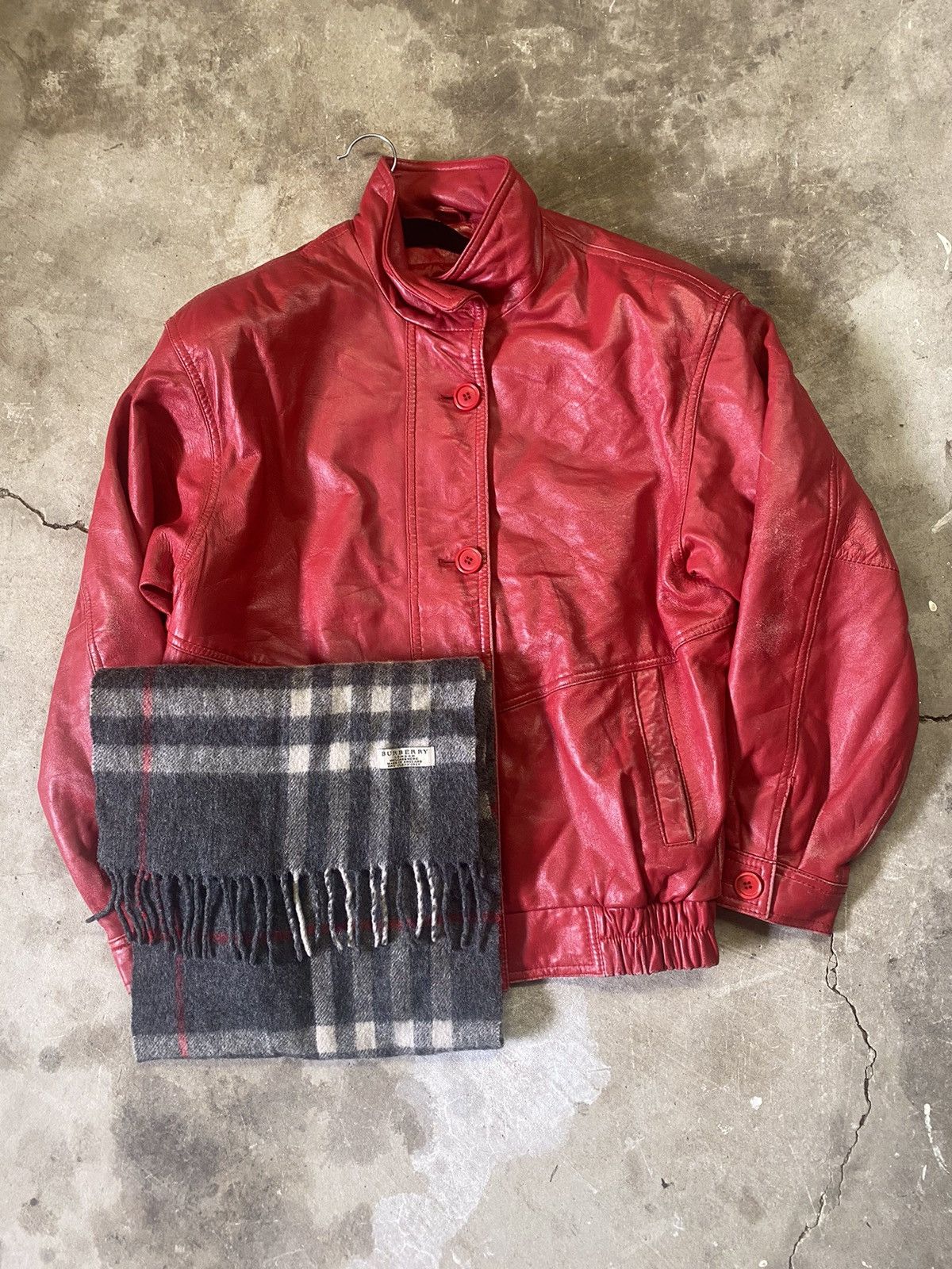 Red leather bomber jacket paired with free Burberry scarf