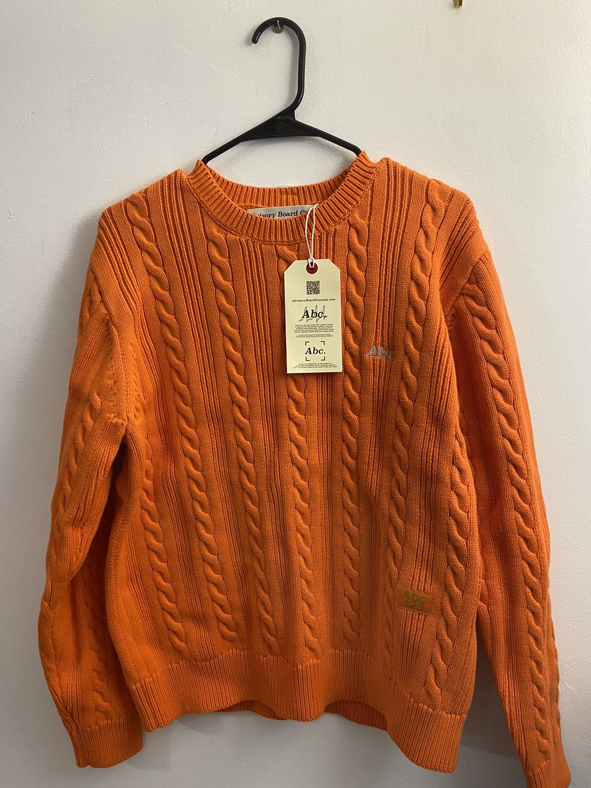 image of Advisory Board Crystals Abc 123 Cableknit Crewneck Sweater (Carnelian Orange), Men's (Size Medium)