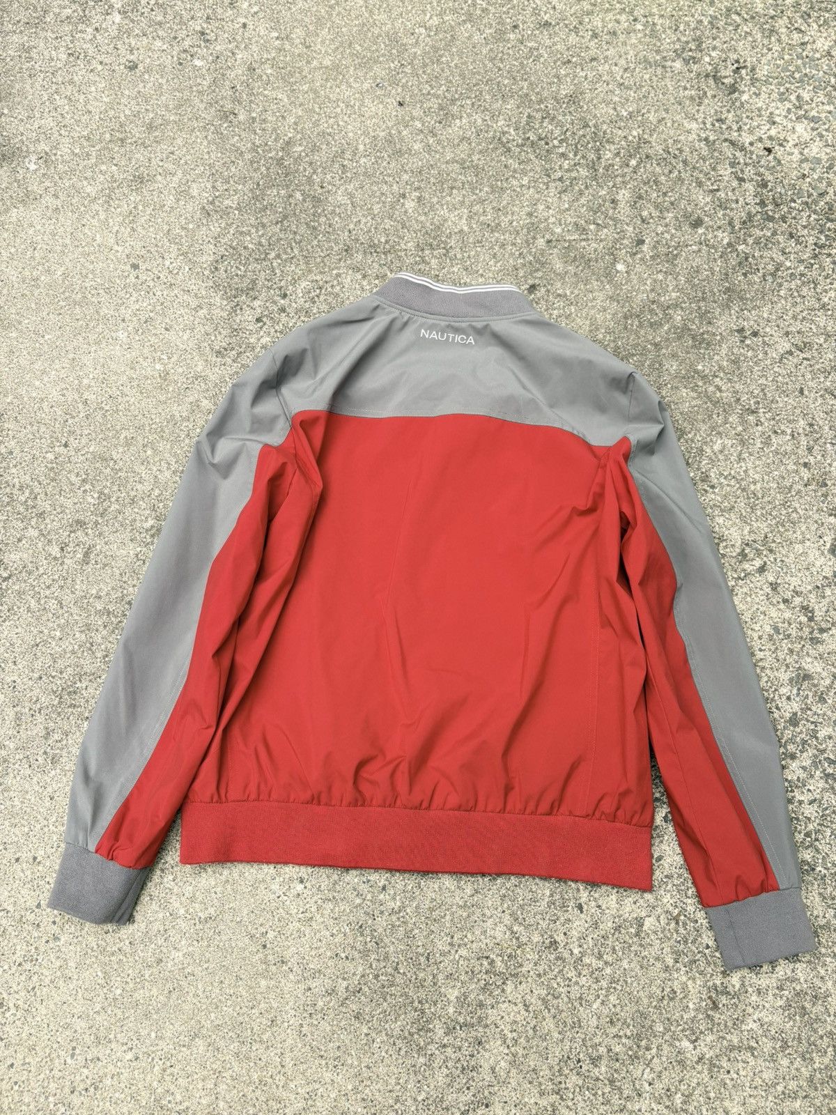 Nautica Nautica full-zip bomber in a red and grey colorblock build. Size US L / EU 52-54 / 3 - 6 Thumbnail