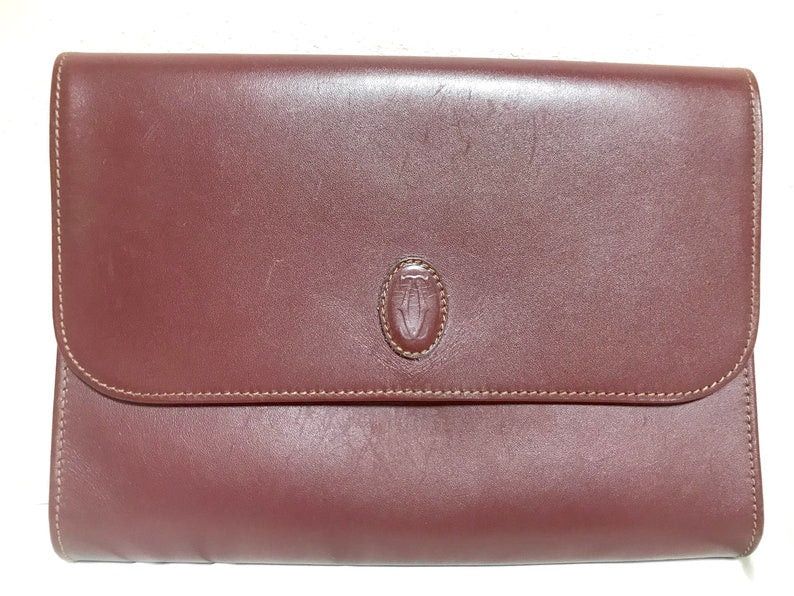 image of Vintage Cartier Wine Leather Clutch Bag, Mini Document Purse With Logo Motif. Unisex Bag From Must 