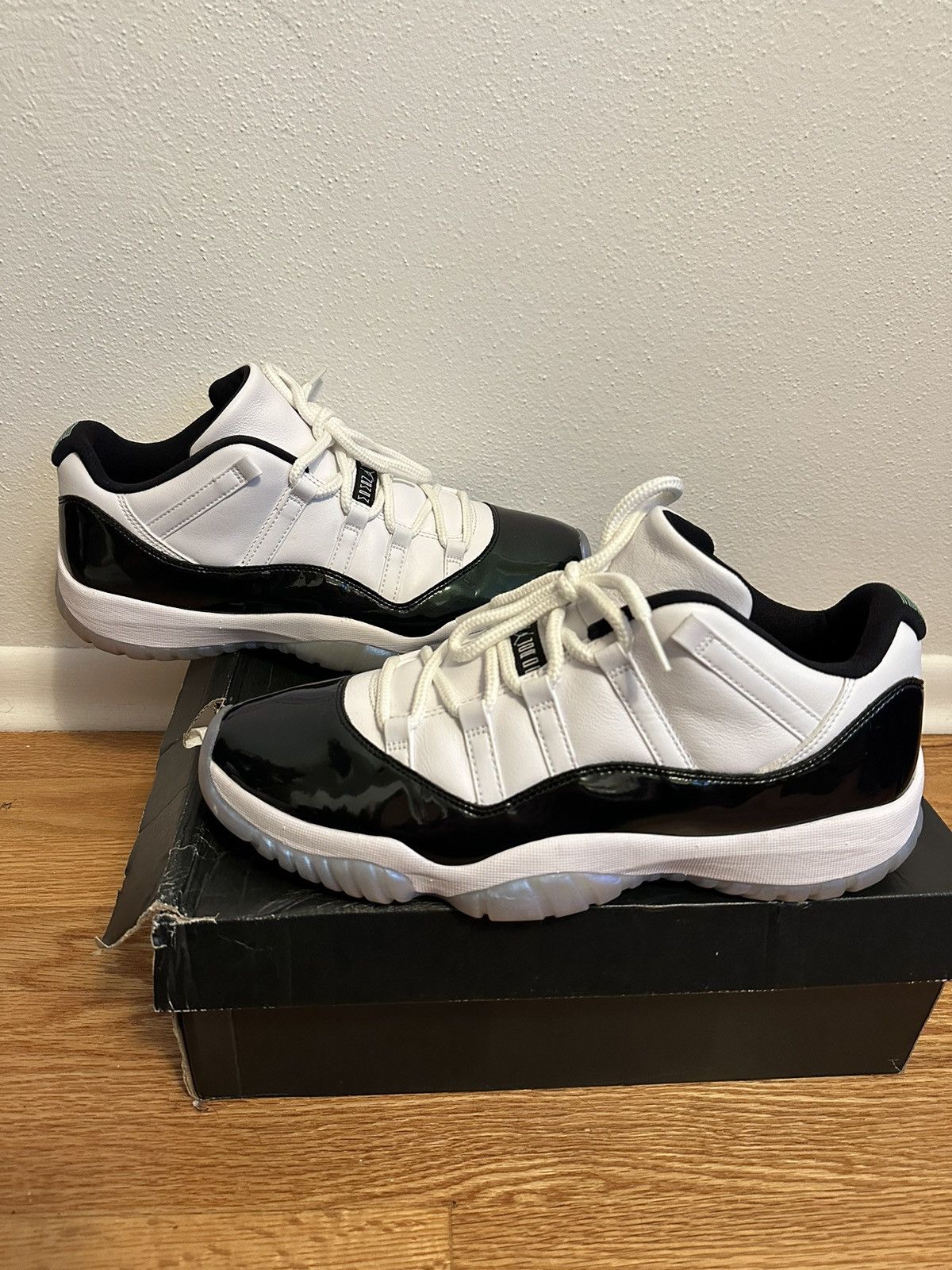 image of Air Jordan 11 Retro Low Black-Emerald Shoes in White/Black, Men's (Size 12)