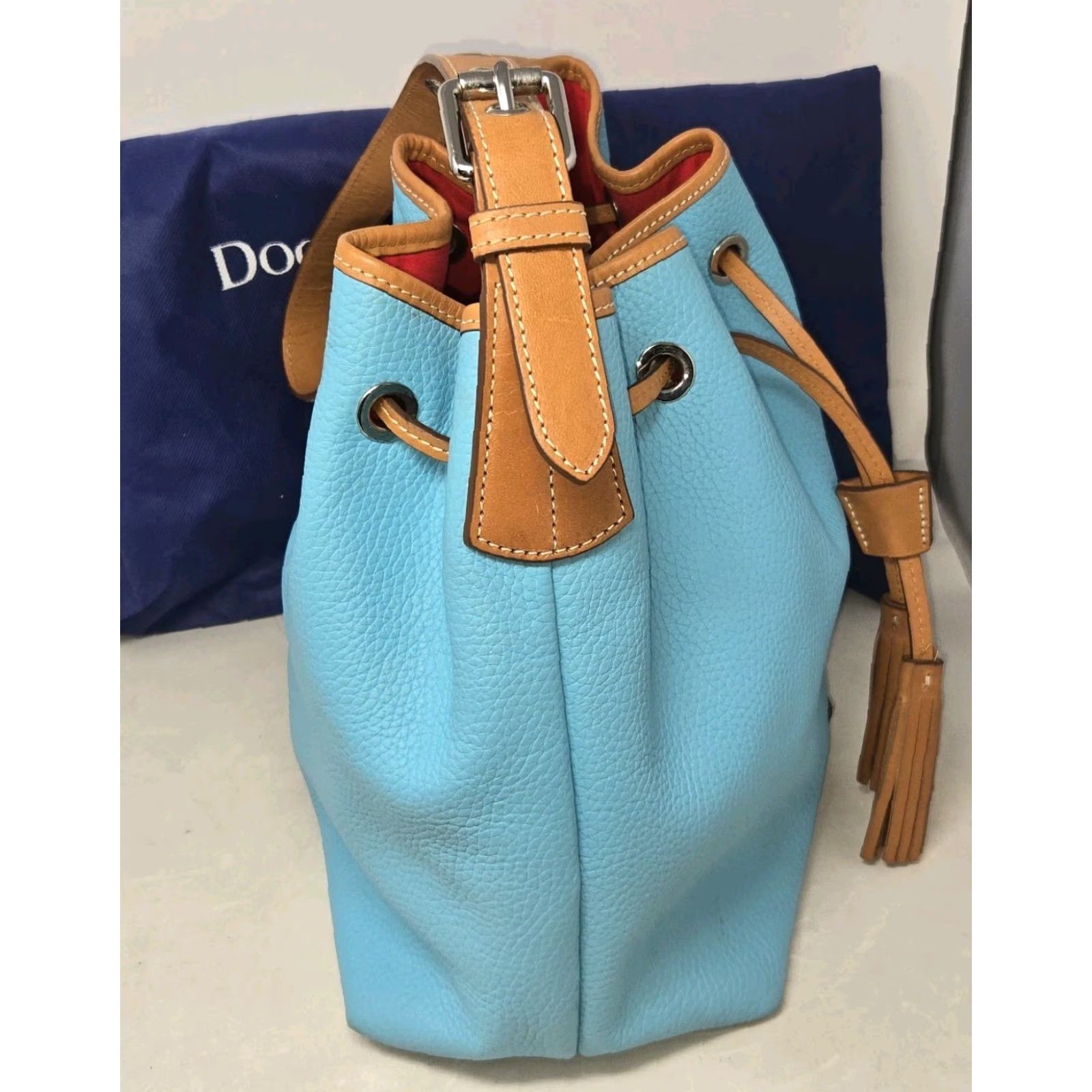 Dooney & Bourke Dooney & Bourke All Weather Leather Drawstring Bucket Bag Turquoise Dust Bag Turquoise Pebble Grain Leather Bucket & Drawstring Bag Womens Size ONE SIZE - 5 Thumbnail