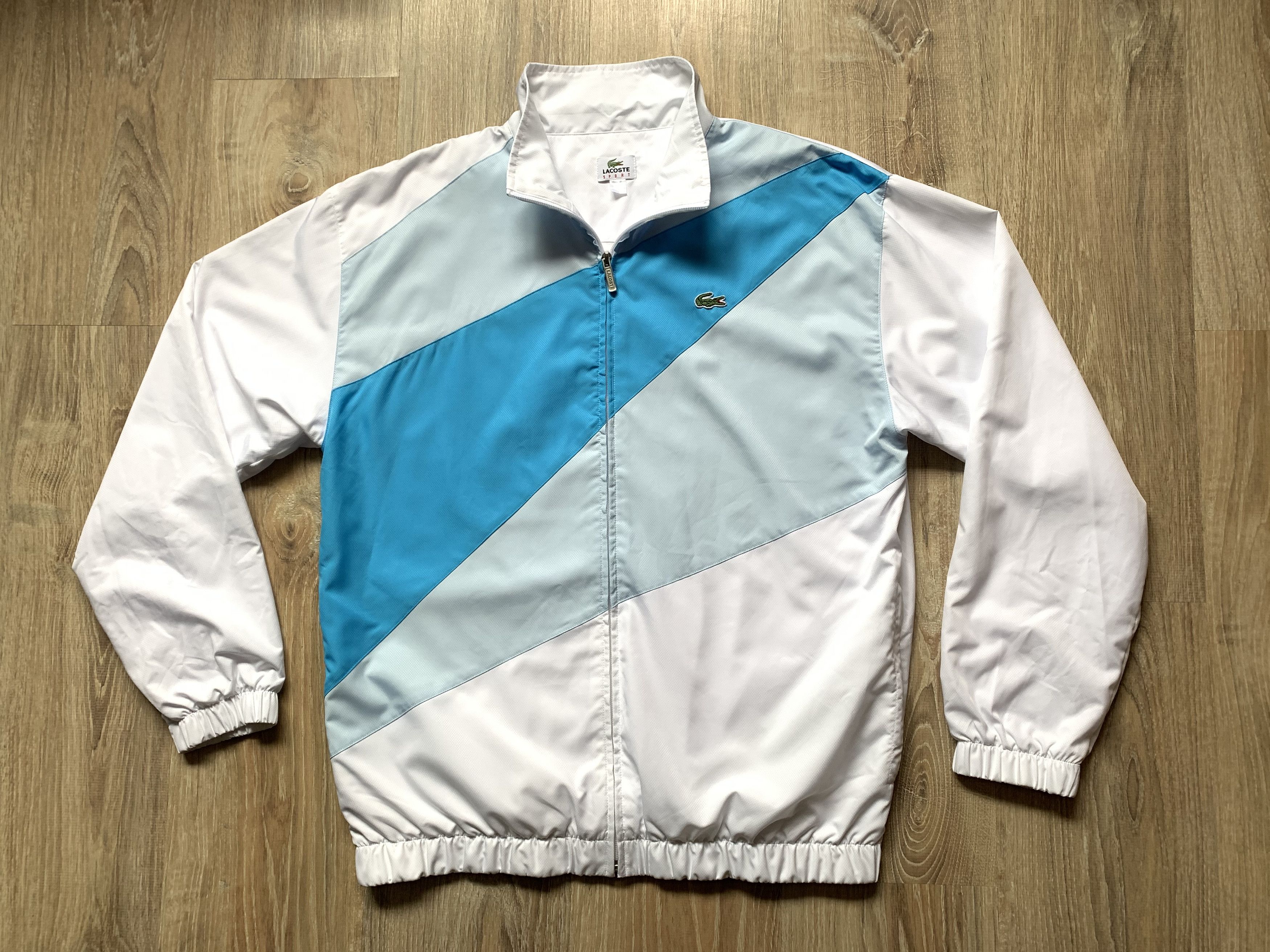 image of 80's Lacoste Sport Olympic Light Jacket Nylon in White/Blue, Men's (Size Large)