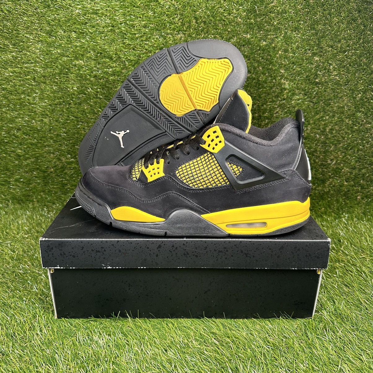 image of Jordan Nike Air Jordan 4 Lightning 2023 Shoes in Black/Yellow, Men's (Size 14)