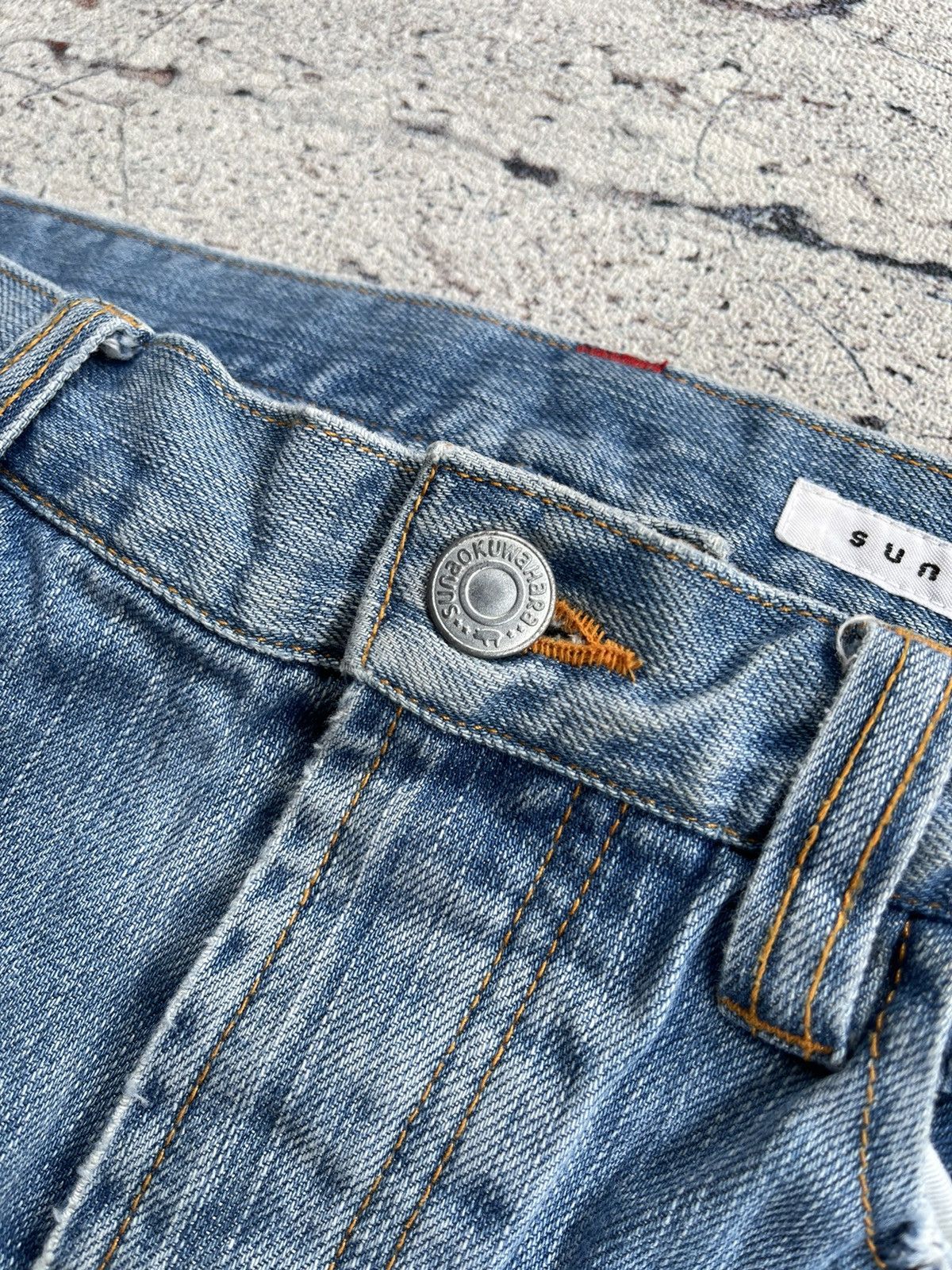 Sunao kuwahara distressed jeans by issey miyake