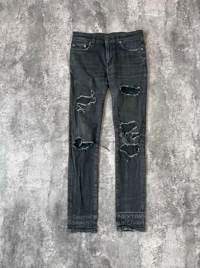 Saint Laurent Paris Saint Laurent Paris Cut-out worn-out denim jeans Size US 30 / EU 46 - 1 Thumbnail