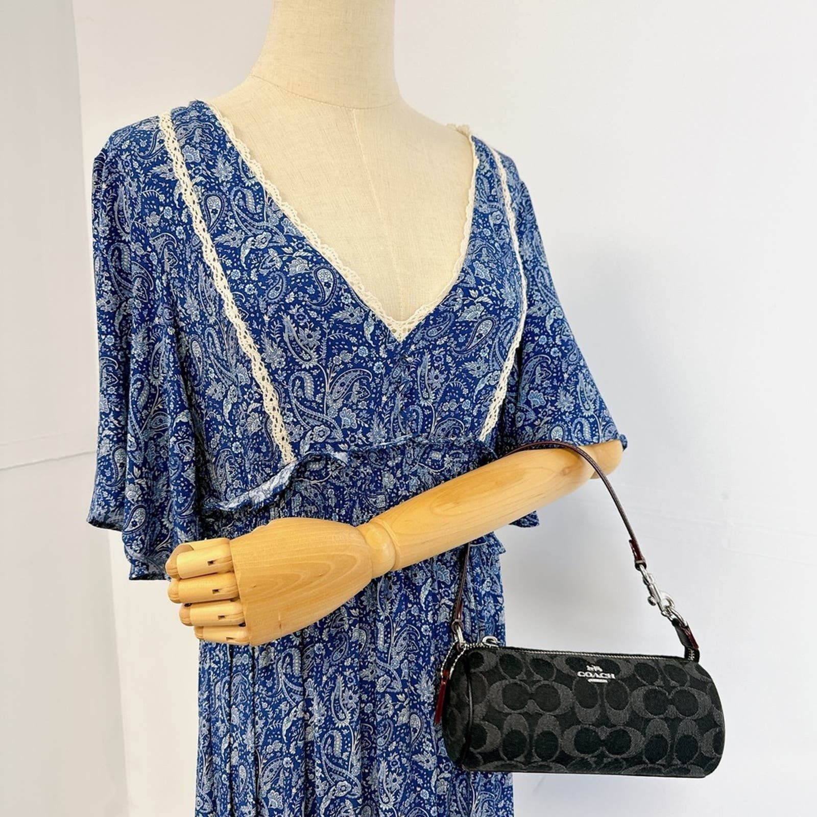 image of Coach Cp258 Nolita Barrel Bag In Signature Denim In Black, Women's