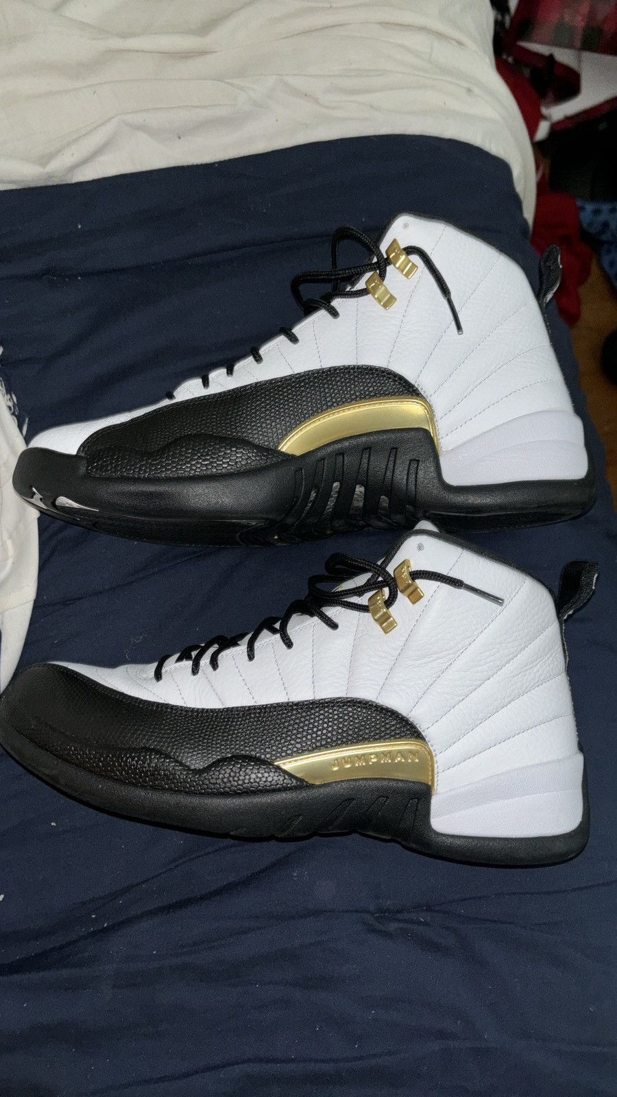 image of Jordan Brand 12 Royalty Taxis Shoes in Black, Men's (Size 13)