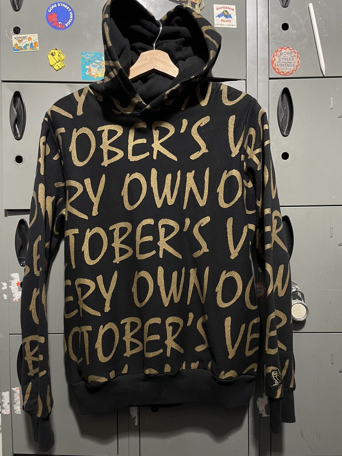 Octobers Very Own × Streetwear OVO all over text logo hoodie gold print ...