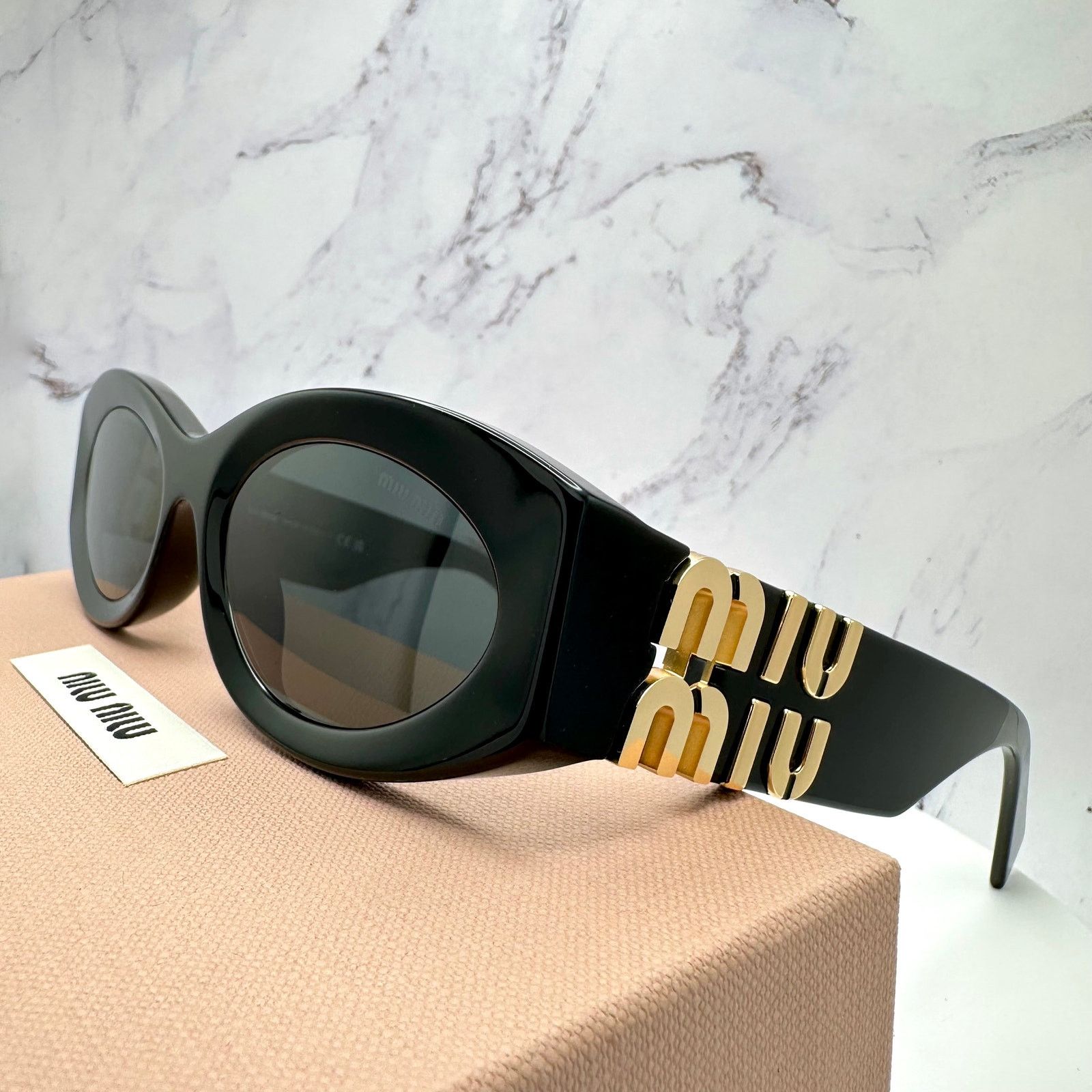 New MIU MIU Sunglasses Black Oval Acetate Gold Metal Logo