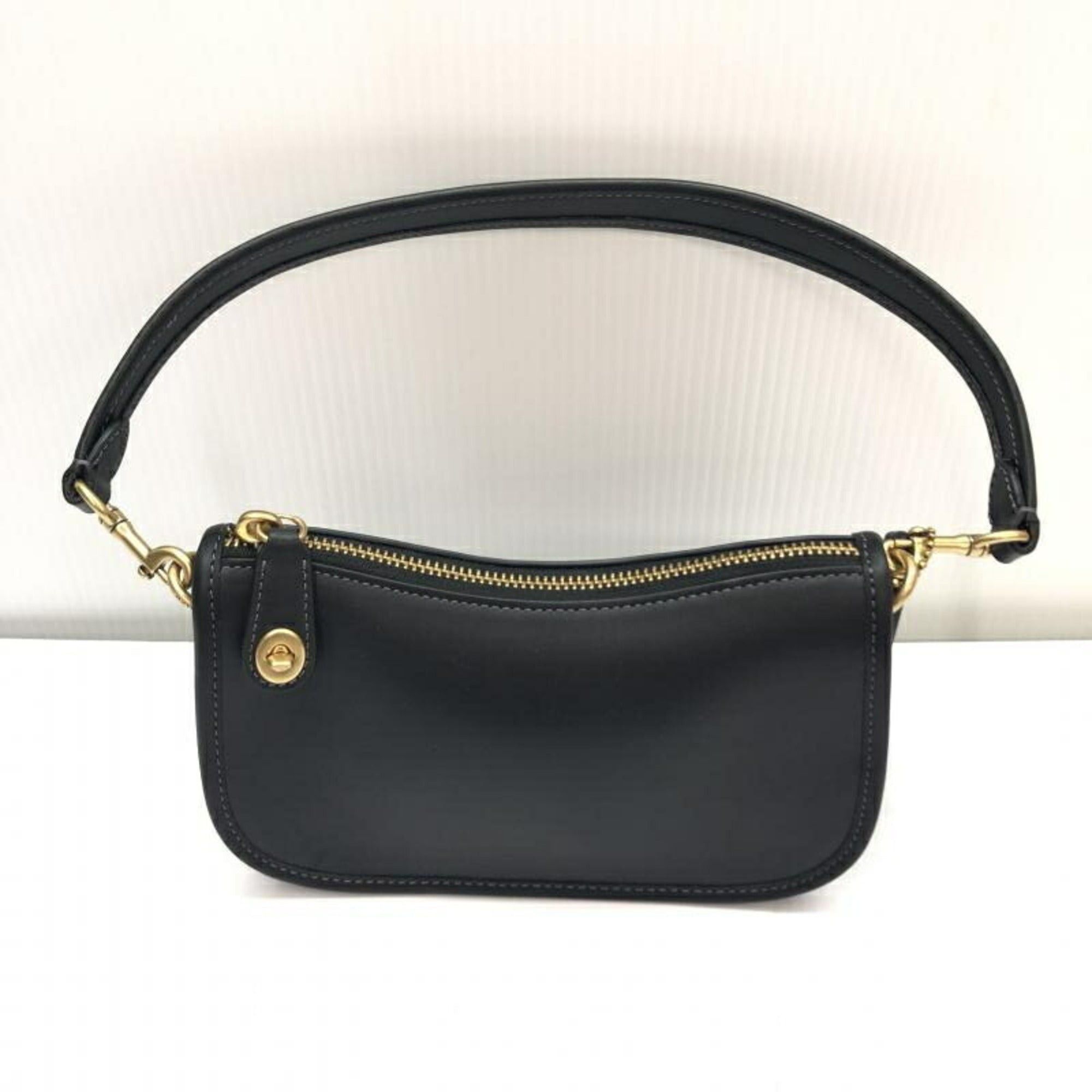 image of Coach Women's Black The Originals Glovetanned Leather Swinger Bag