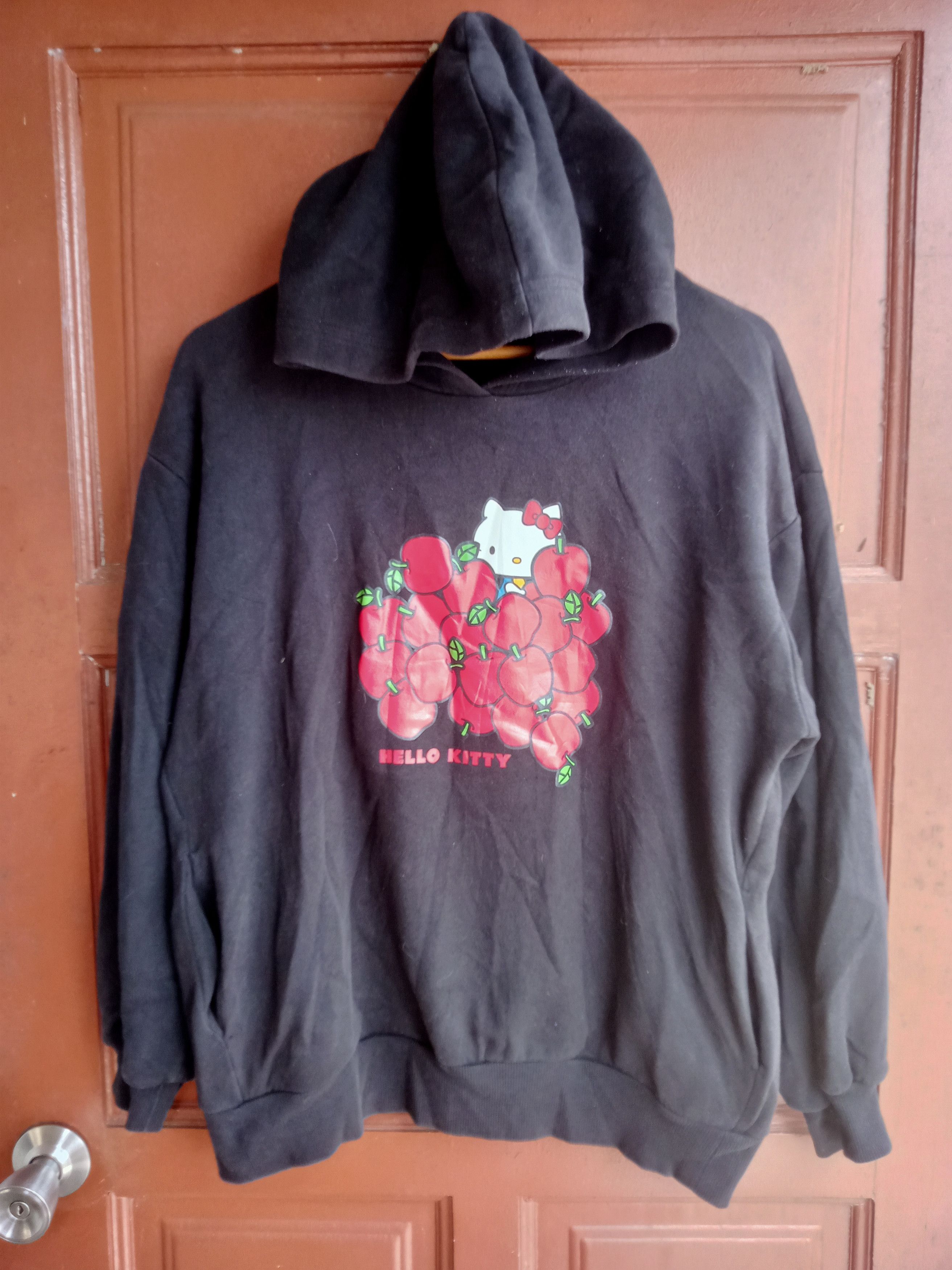 image of Anima x Cartoon Network Hello Kitty X G.u Apples Hoodie Sweatshirt in Black, Men's (Size Medium)
