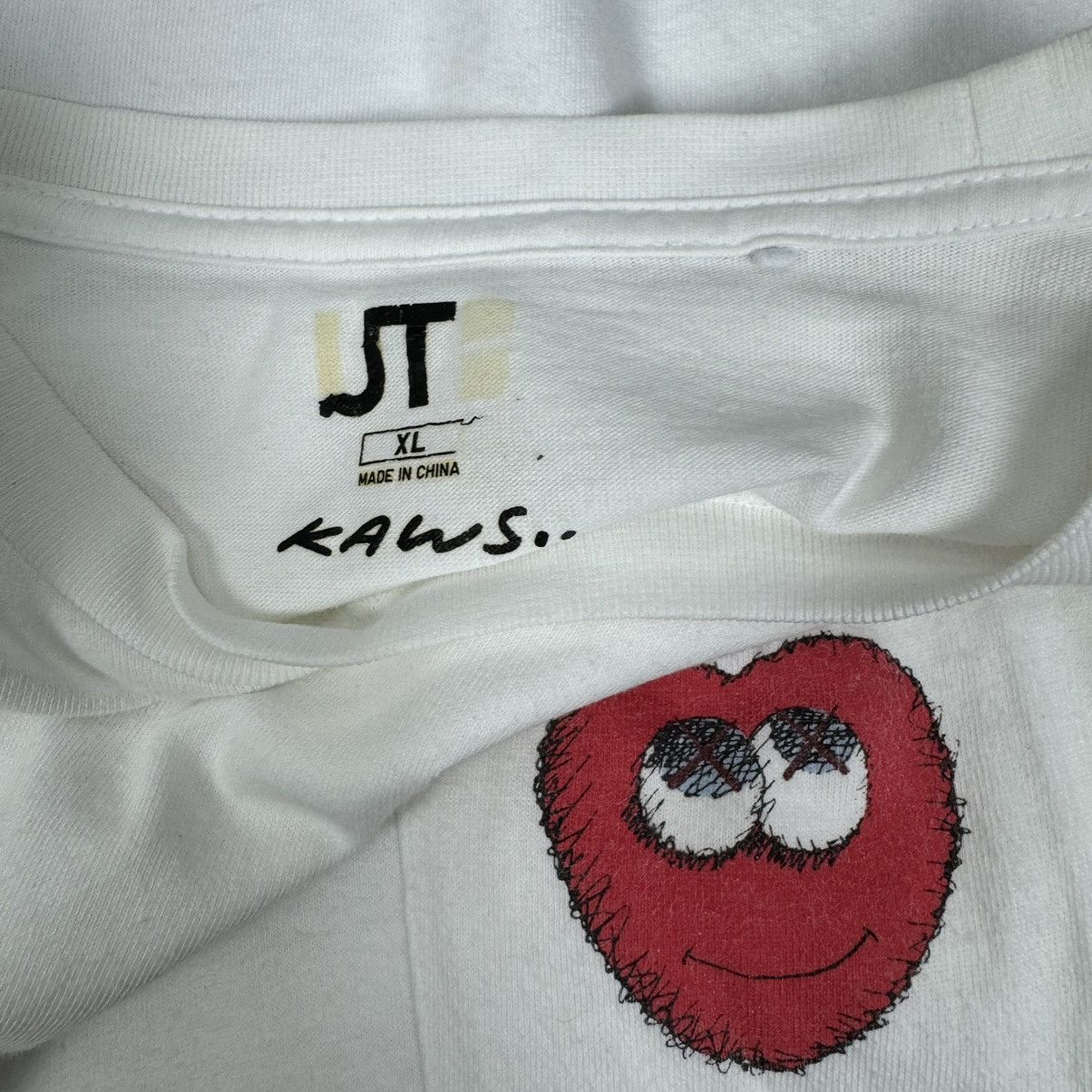 Kaws × Uniqlo ❄️Kaws x Uniqlo Red Heart Pocket T shirt Size US XL / EU 56 / 4 - 6 Thumbnail