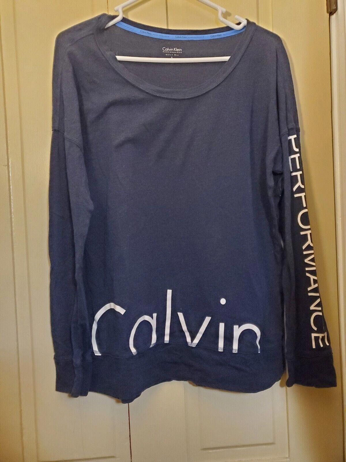 Calvin Klein CALVIN KLEIN PERFORMANCE TOP L Blue Long Sleeved T-shirt Size L / US 10 / IT 46 - 1 Thumbnail