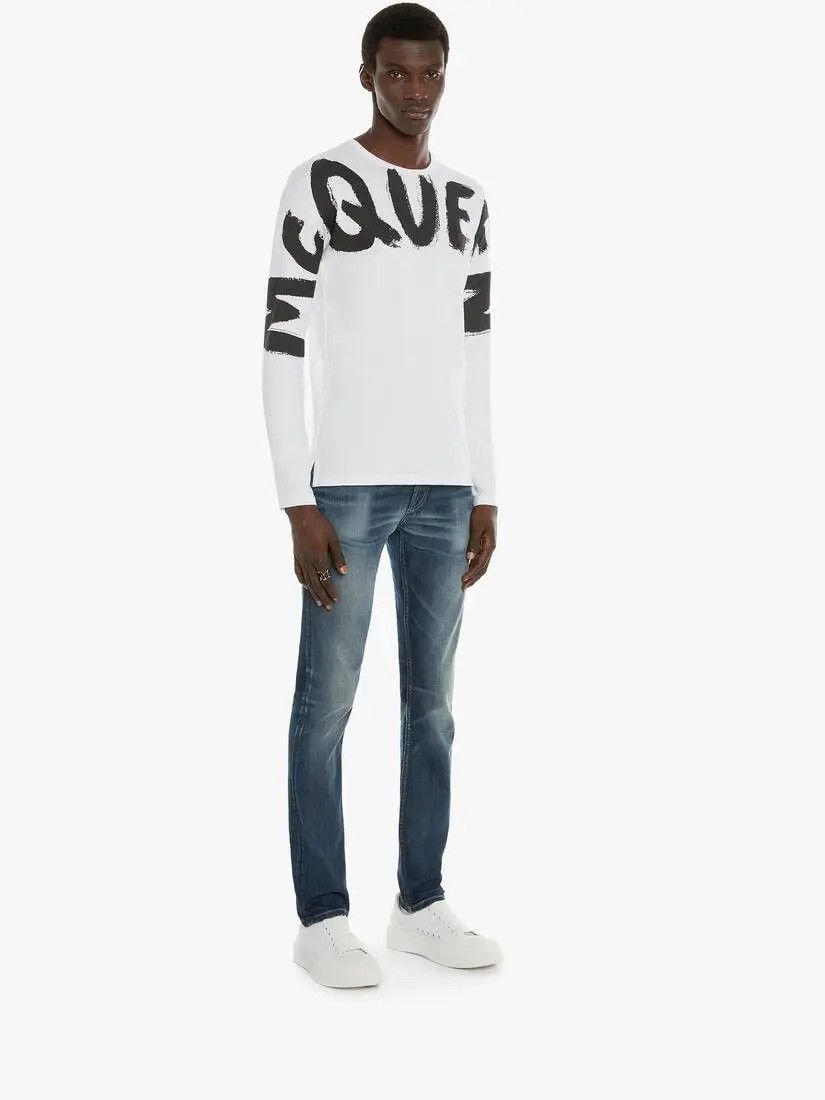 o1w1db10925 Mcqueen Graffiti Denim Jeans in Washed Blue