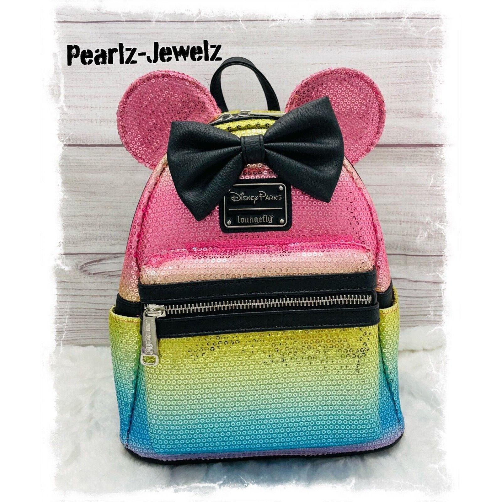 image of Loungefly Disney Parks Minnie Mouse Rainbow Sequin Bow Mini, Women's
