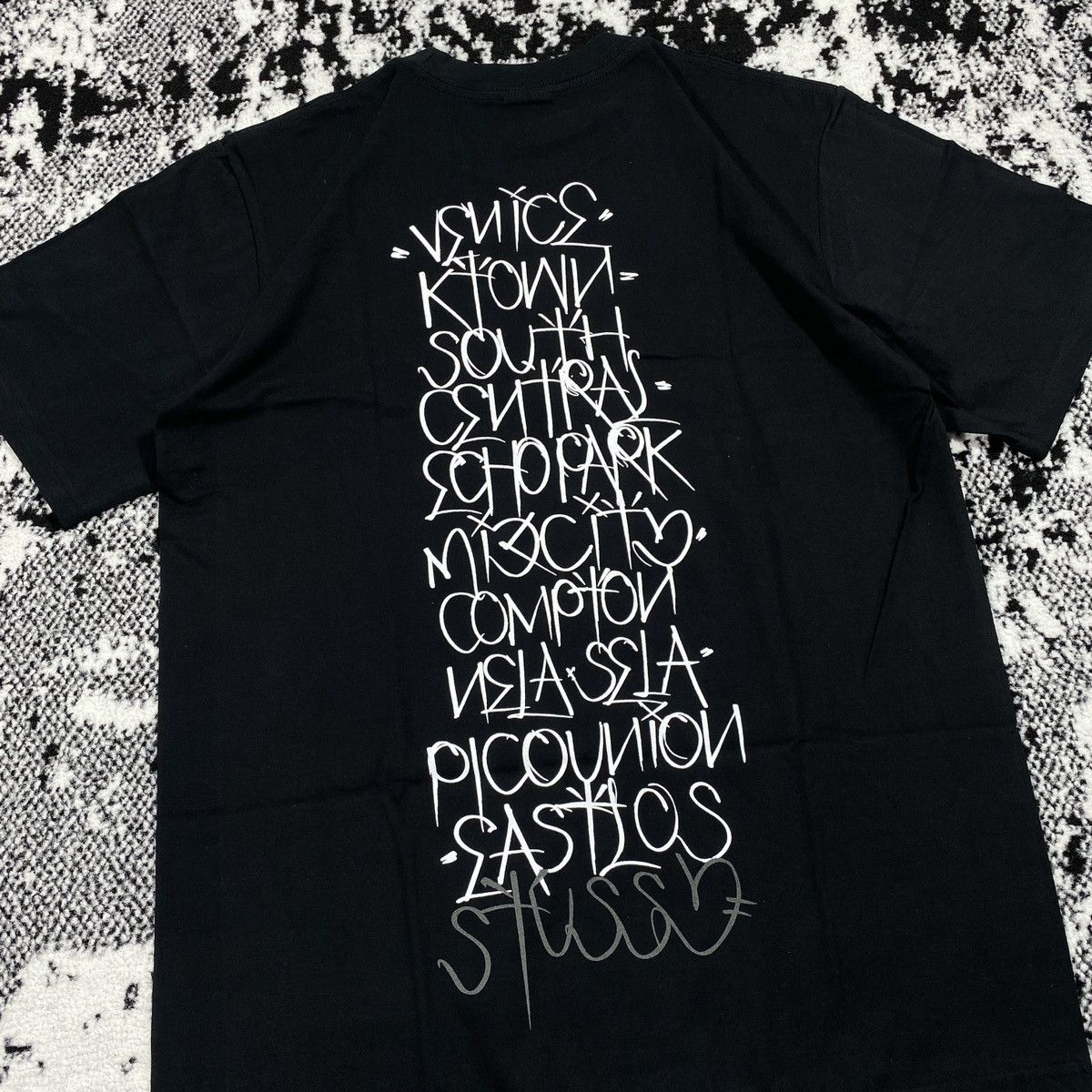 Stussy STUSSY BORN X RAISED 8 HANDSTYLES TEE IN BLACK | Grailed