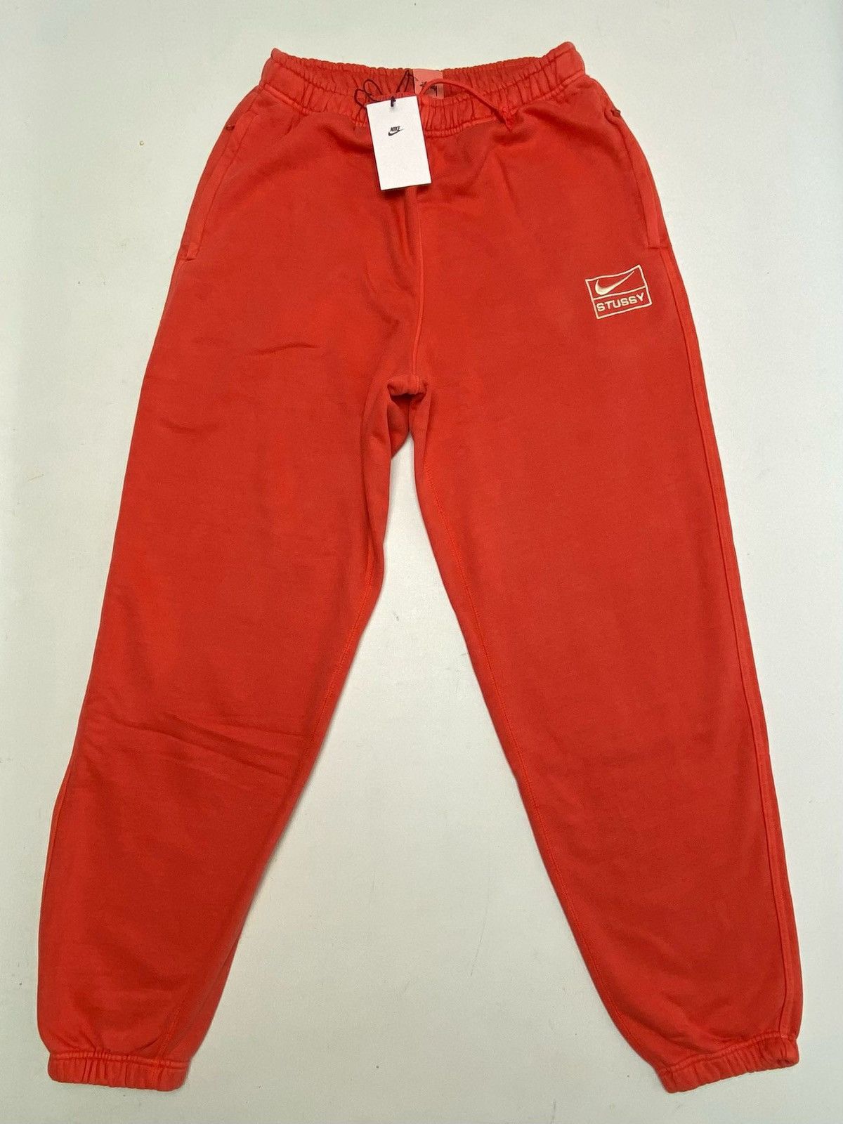 image of Stüssy X Nike Pigment Dyed Fleece Pant Habanero Red, Men's (Size 30)