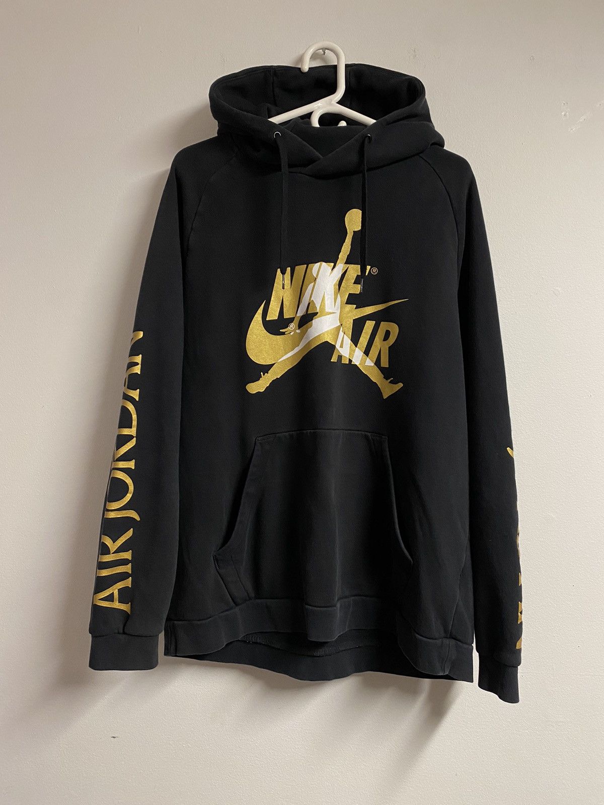 Jordan hoodie black and gold on sale