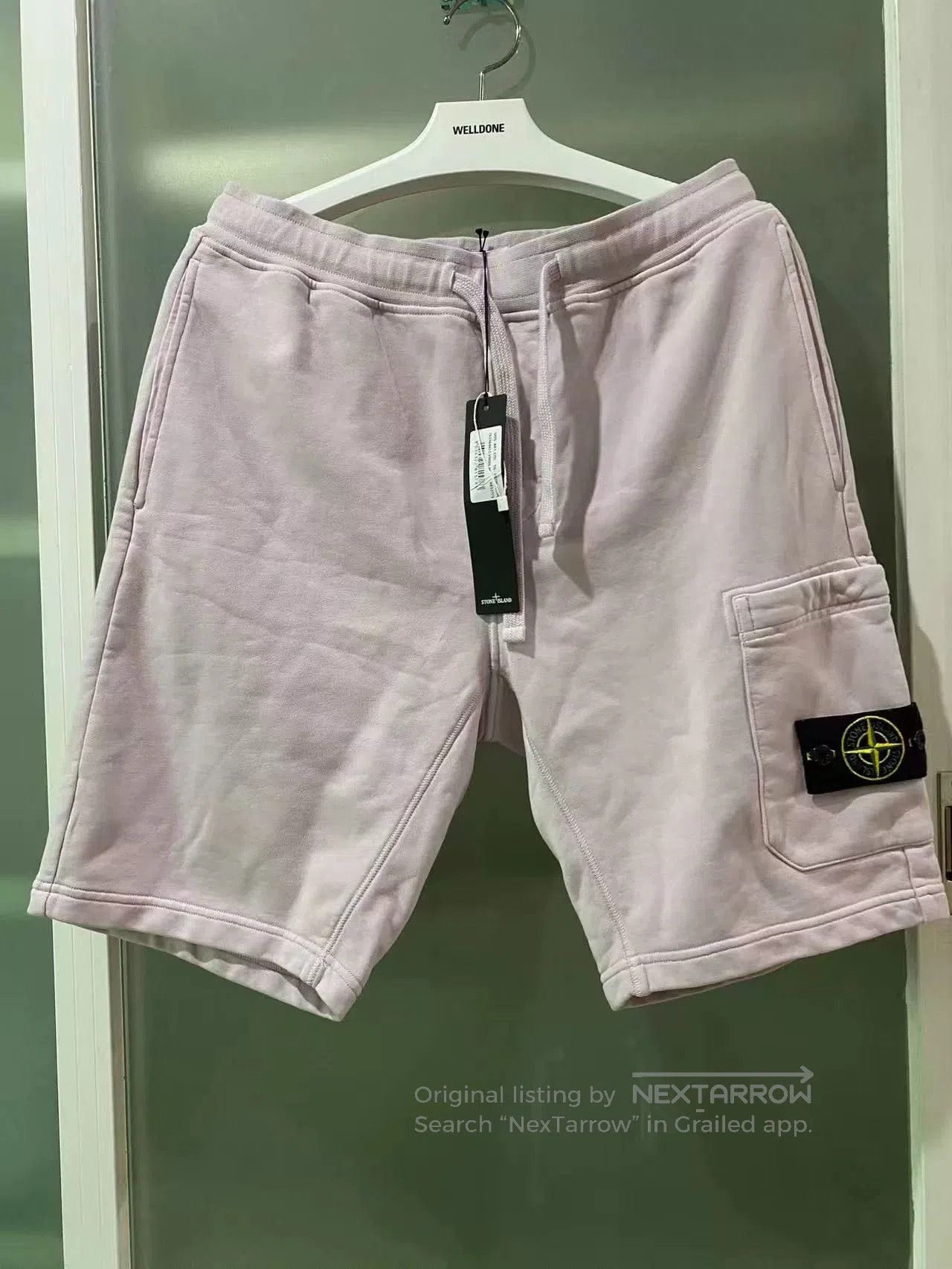 stone island label athletic shorts in pink.