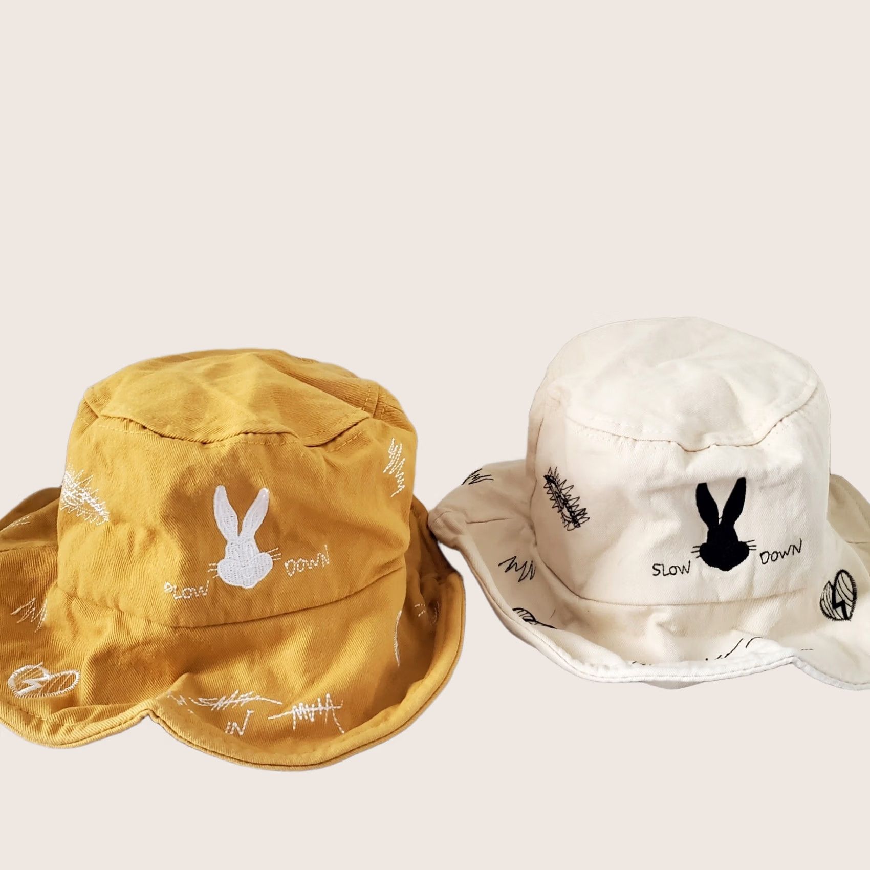 Set of 2 Rabbit Slow Down Embroidered Bucket Hats Mustard Yellow and Cream Cap Station - Duck Embroidered Bucket Hat, white reversible  main image 4