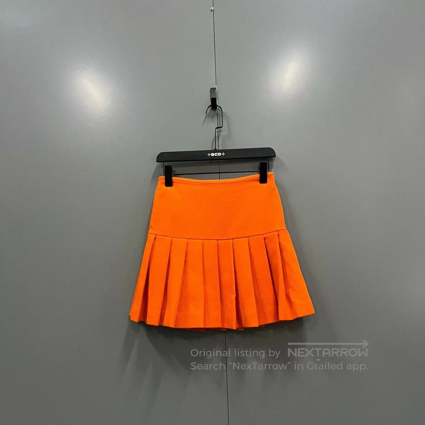 miu miu orange pleated short skirt.