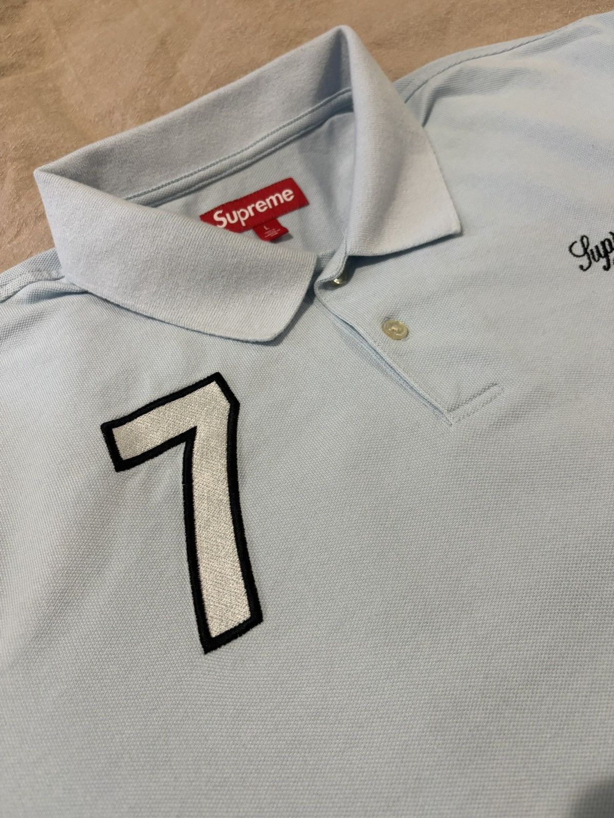 Supreme Supreme 7 Polo SS25 Light Blue | Grailed