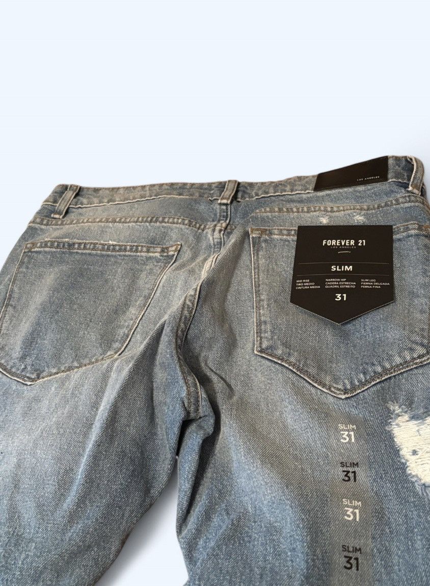 Forever 21 Blue distressed slim jeans with ripped knees size 31 Size US 31 - 6 Thumbnail