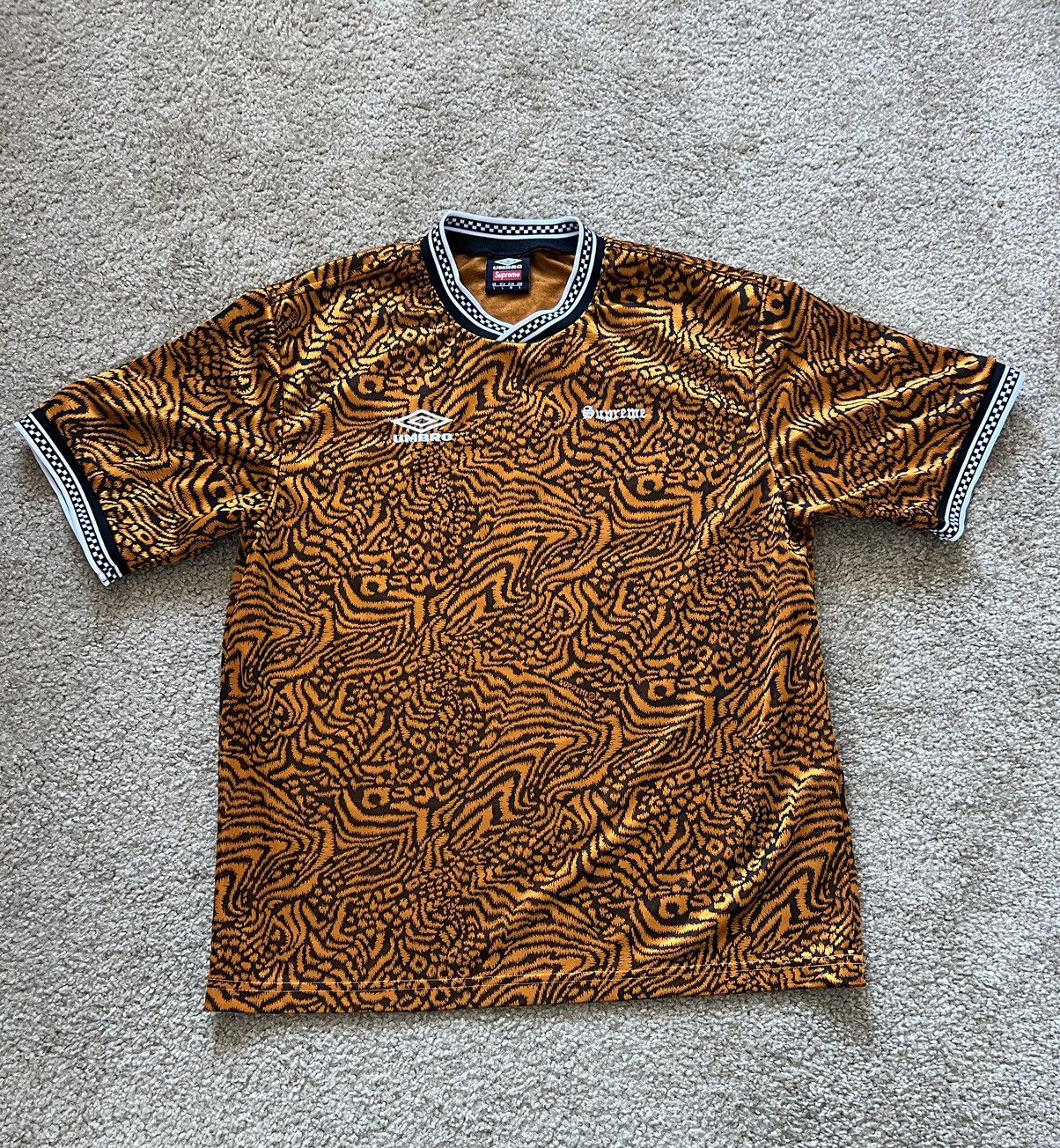 Supreme® / Umbro Jacquard Animal Print Soccer Jersey Poly jersey with  jacquard pattern and checkerboard rib collar. Embroidered logos on…