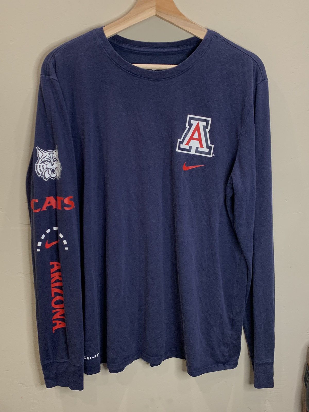 Image of American College x Collegiate Nike Arizona Wildcats Dri-Fit College Long Sleeve Shirt in Navy/Red/W