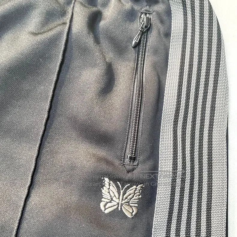 NEEDLES ZIPPED TRACK PANT POLY SMOOTH .
