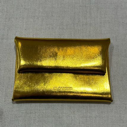 Jil Sander o1loc1c1124 Size: OS/ Glittering Logo Foldable in Golden Size ONE SIZE - 1 Preview