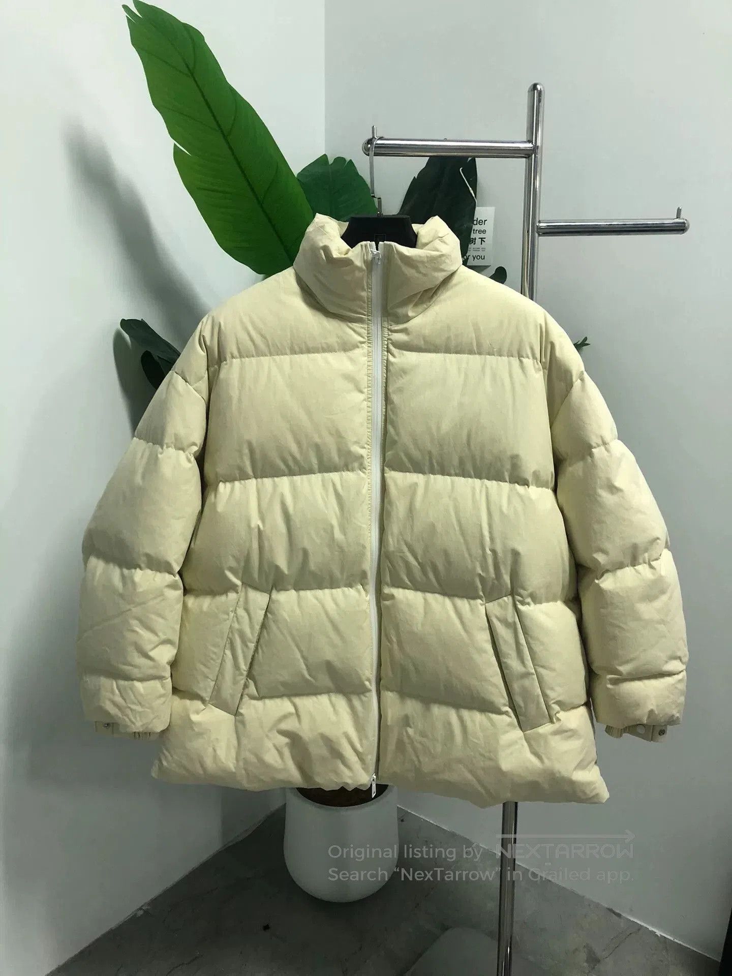 yellow oversized Bottega Veneta puffer jacket.