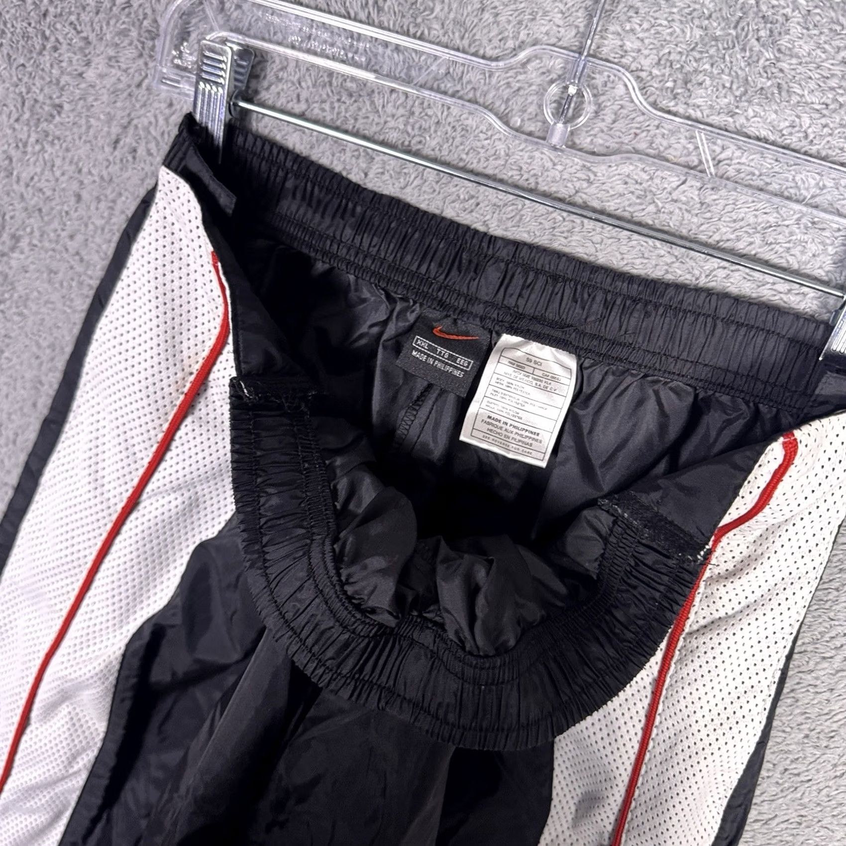 Nike Keywords: "90s Track Pants," "Vintage Nike," "2XL," "Warmup Sweatpant," "Baggy," "Tearaway," "Black" directly address the item’S style and size Size US 39 - 7 Thumbnail