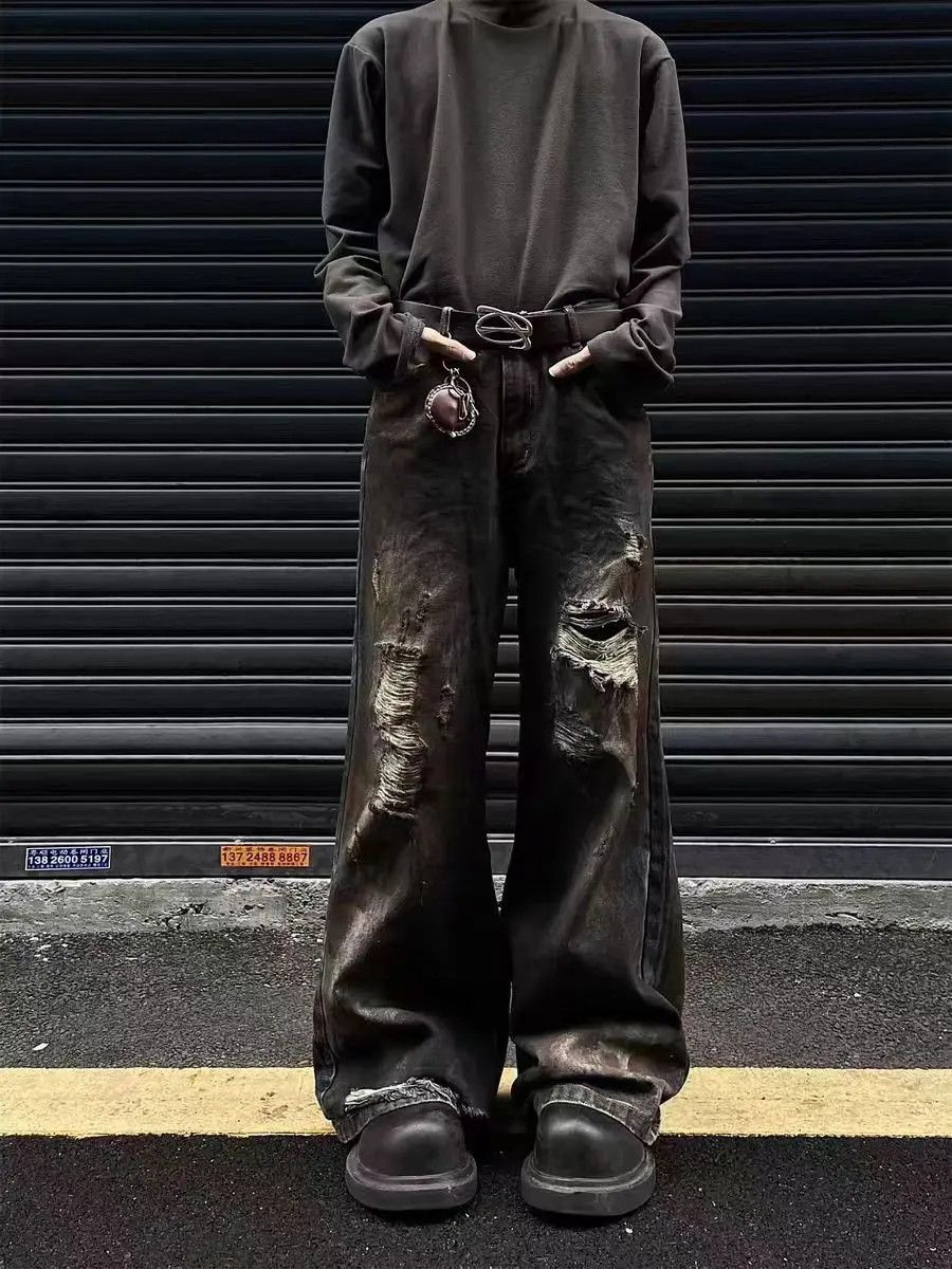 Dirty wash style ripped street jeans