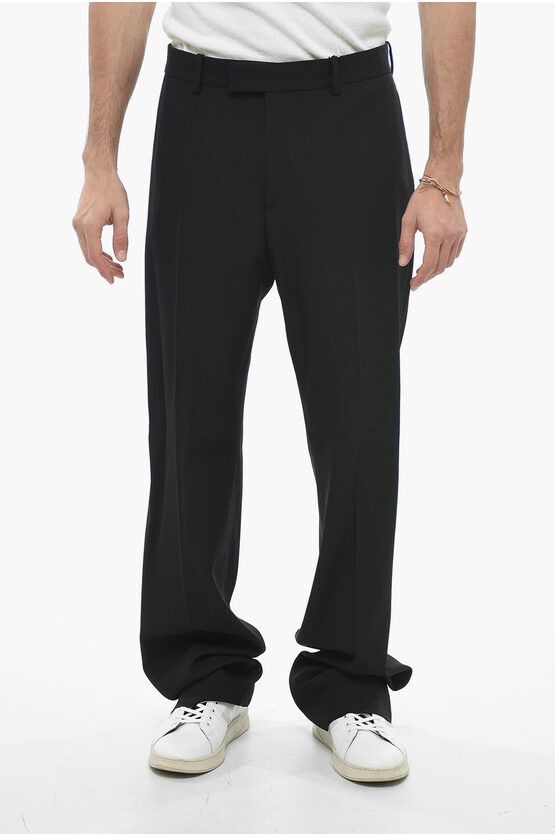 image of Salvatore Ferragamo Virgin Wool Baggy Pants in Black, Men's (Size 34)