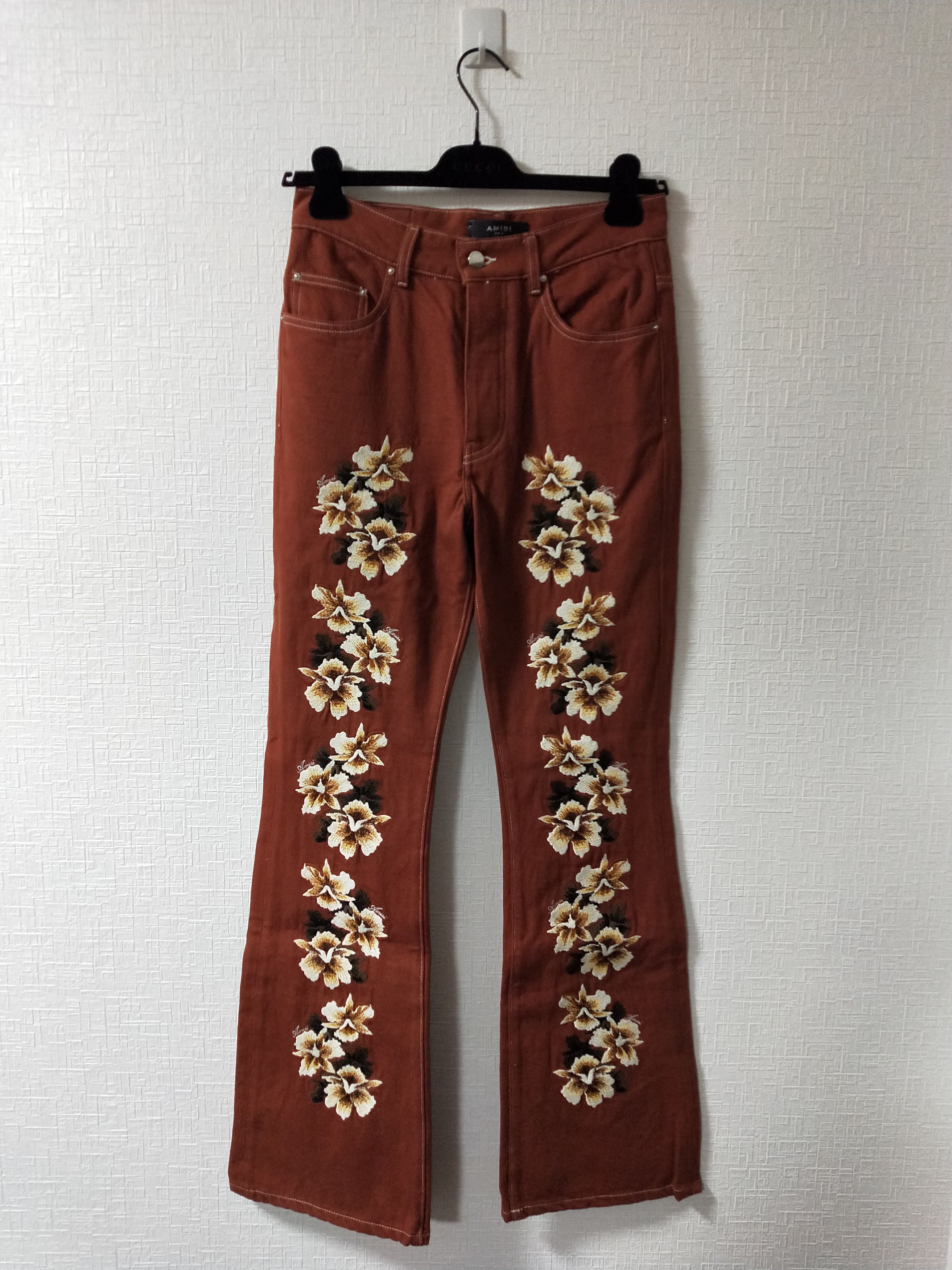 image of Amiri Embroidered Hisbiscus Flare Jeans in Clay, Men's (Size 29)