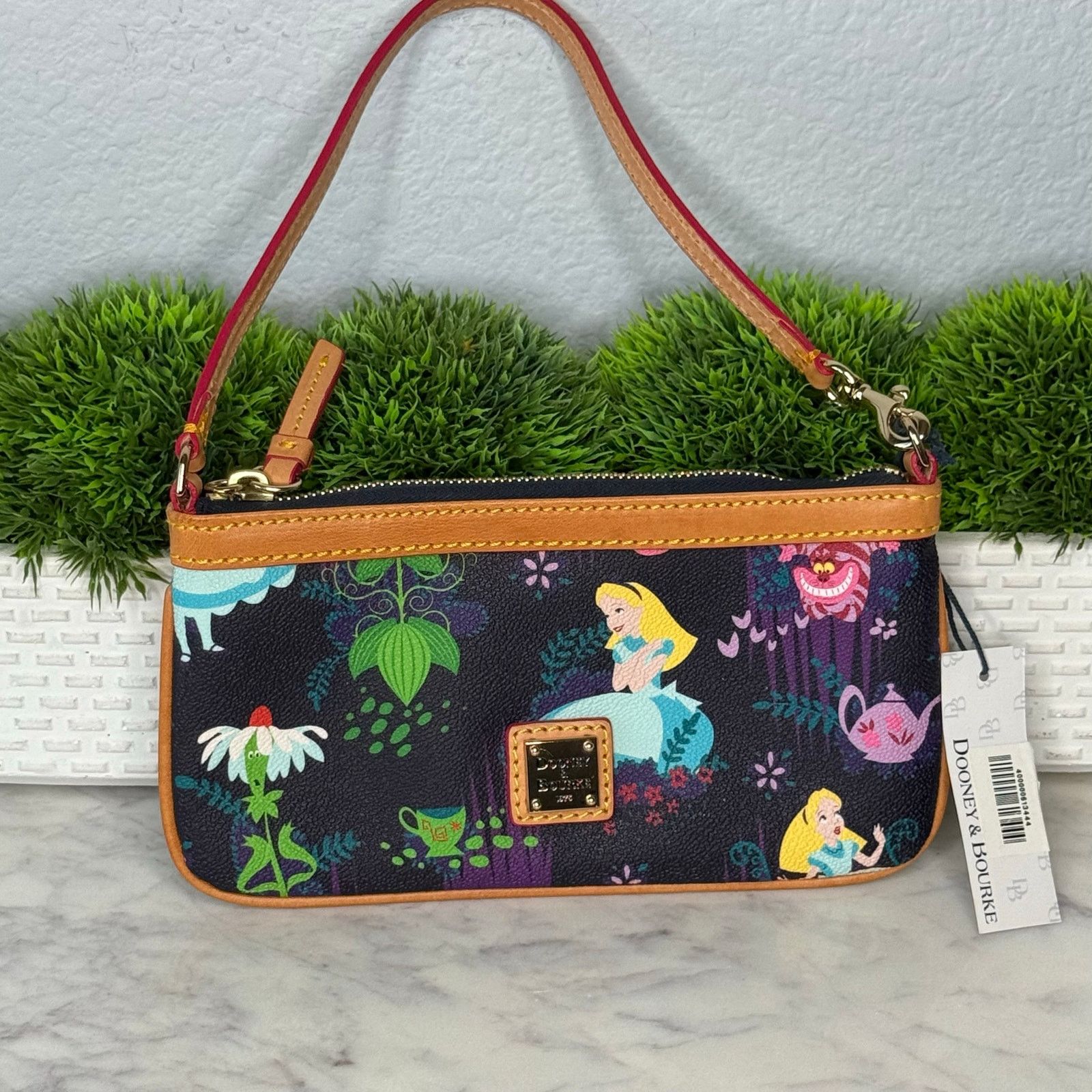 NWT Alice in Wonderland Wristlet by Dooney and Bourke