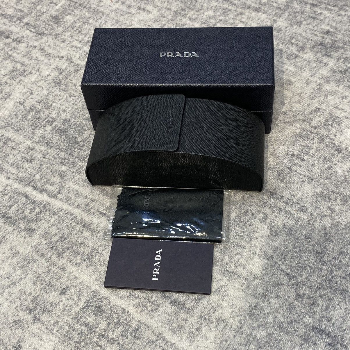 PRADA 0PR 14YS 12R50K TRANSPARENT GREY
