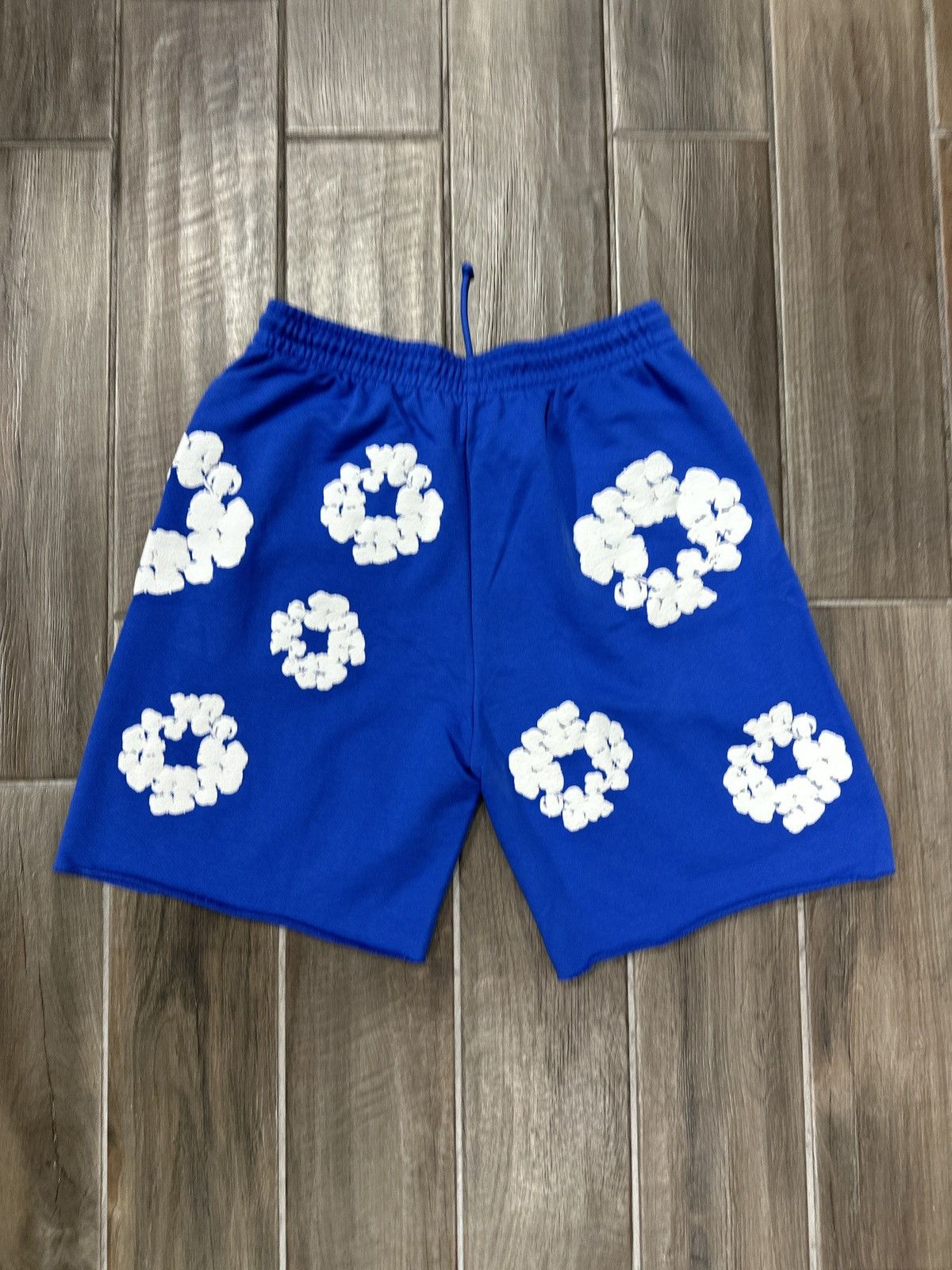DENIM TEARS Denim Tears Cotton Wreath Blue Sweat Shorts | Grailed